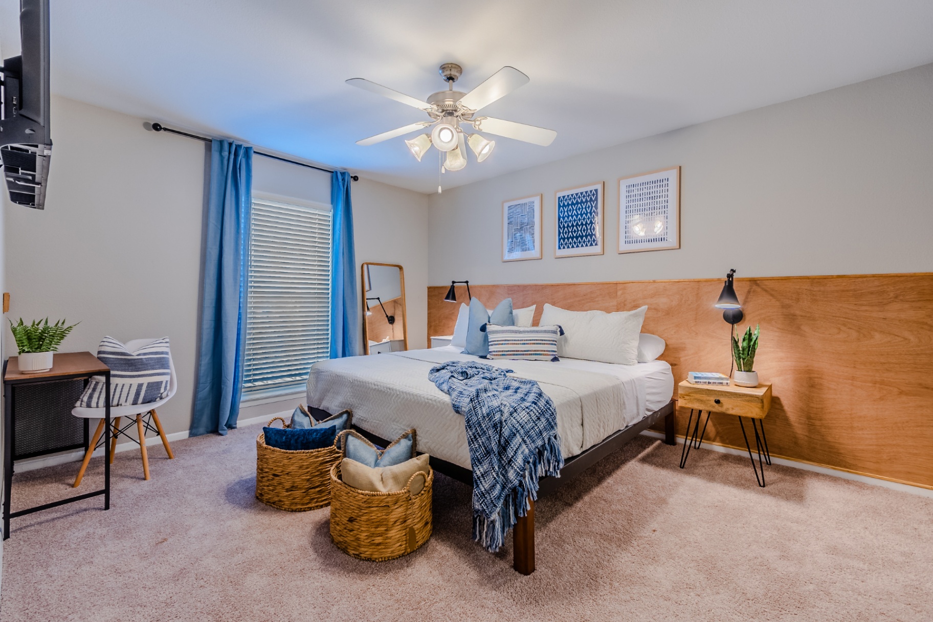 Spacious furnished bedroom with blackout drapes