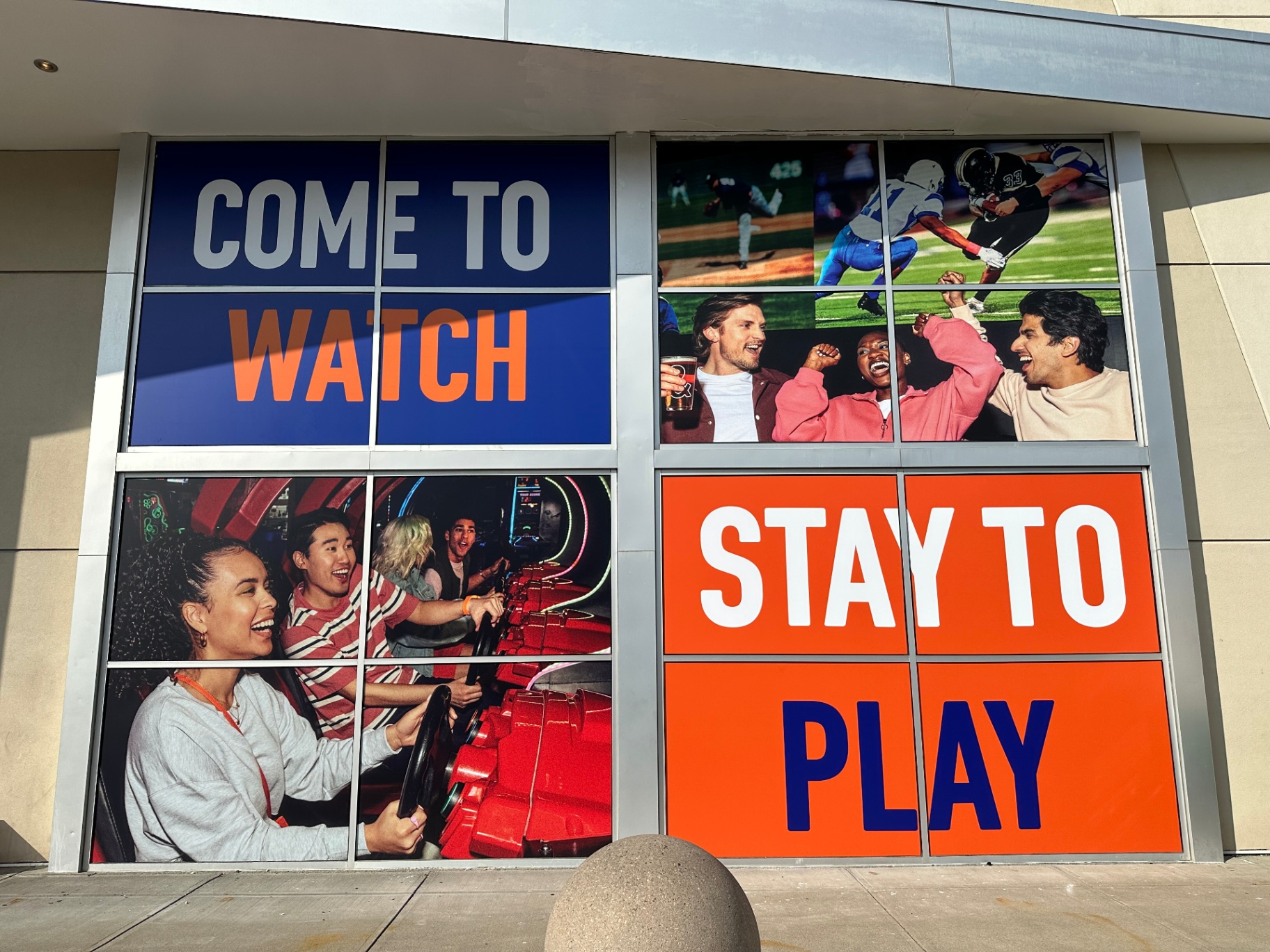 Storefront Vinyl Window Graphics Large full-color vinyl window graphics installed on a commercial storefront, featuring bold text