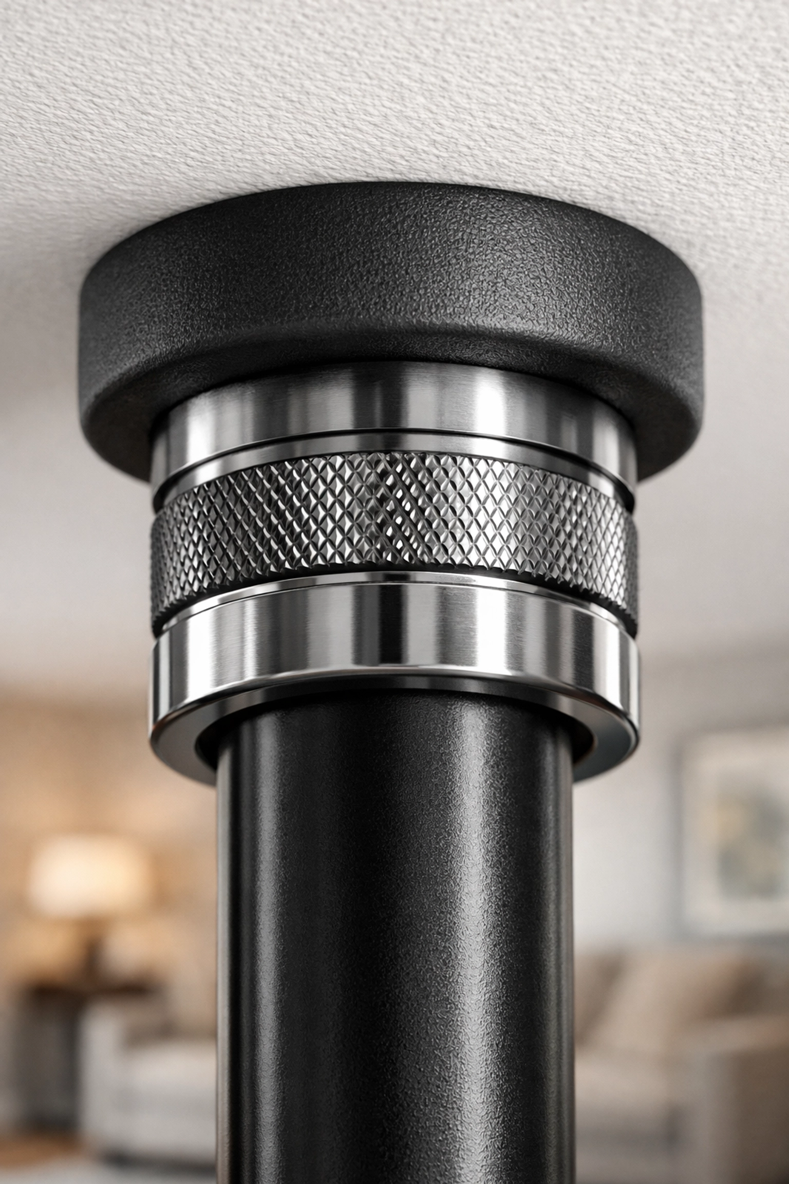 Close-up of the tension pad and steel rail for a damage-free home workout system.