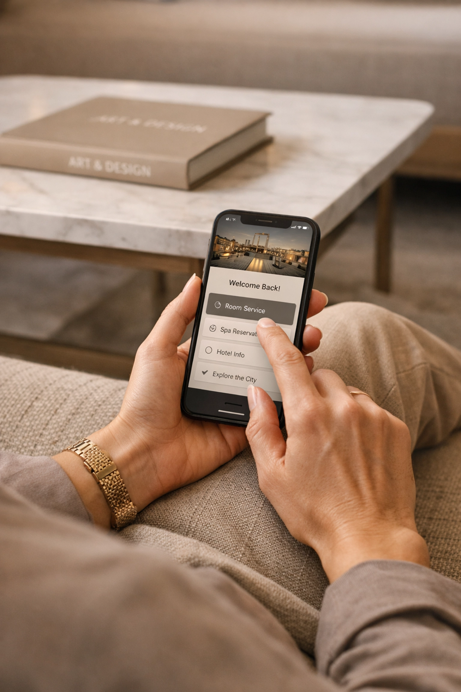 Hotel guest using a mobile phone to experience a seamless digital boutique hotel booking engine.