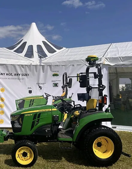 A tractor outside a marquee demonstrating rural event connectivity