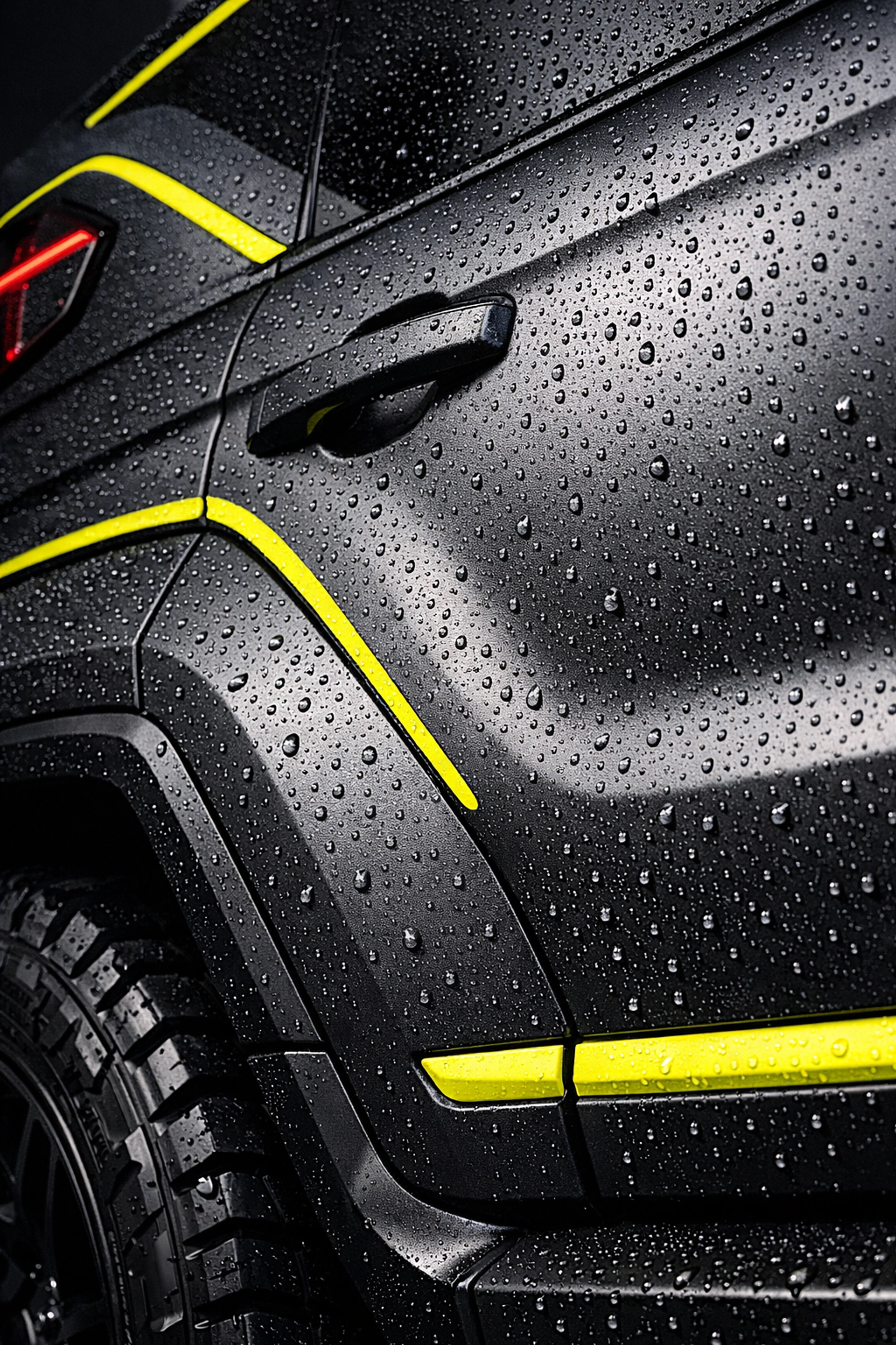 Close-up of a high-quality matte vinyl wrap on an SUV showing moisture resistance and paint protection.