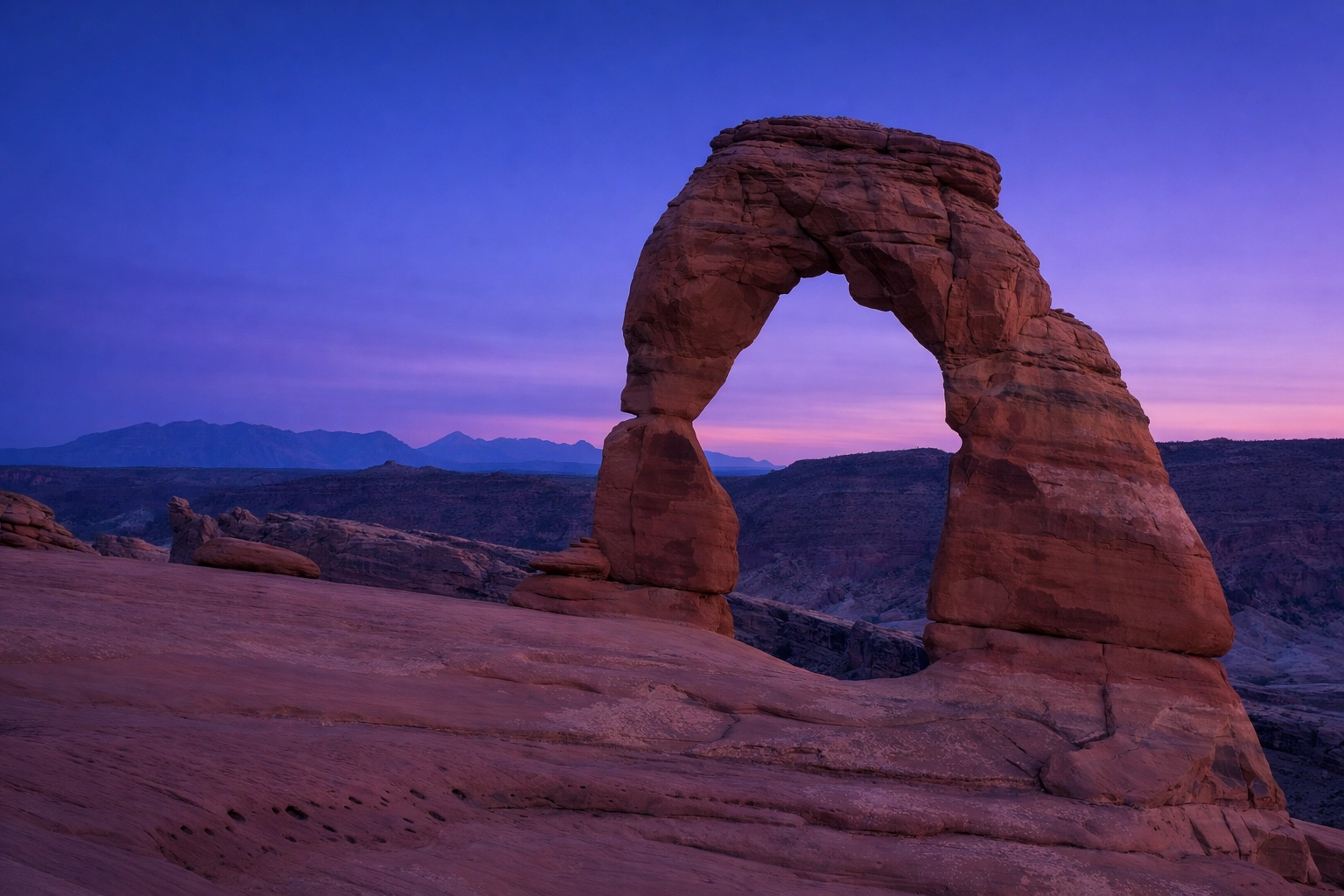 Desert arch at blue hour, representing the best landscape photography locations in Utah.