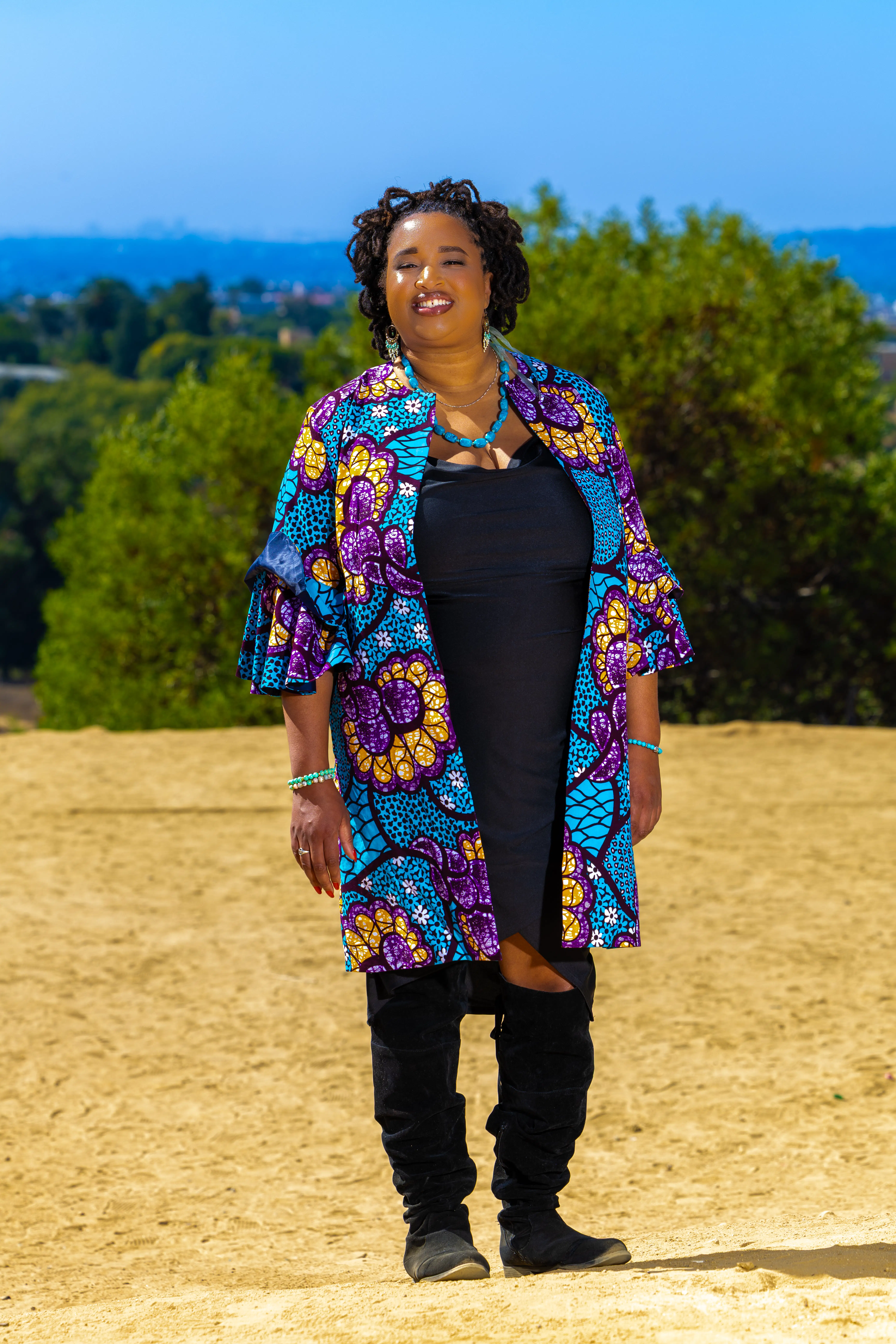 An independent artist focused on storytelling while writing music with substance in a soulful studio. A cozy, vibey studio setup with instruments and handwritten lyrics scattered on a desk, capturing the creative process of songwriting.