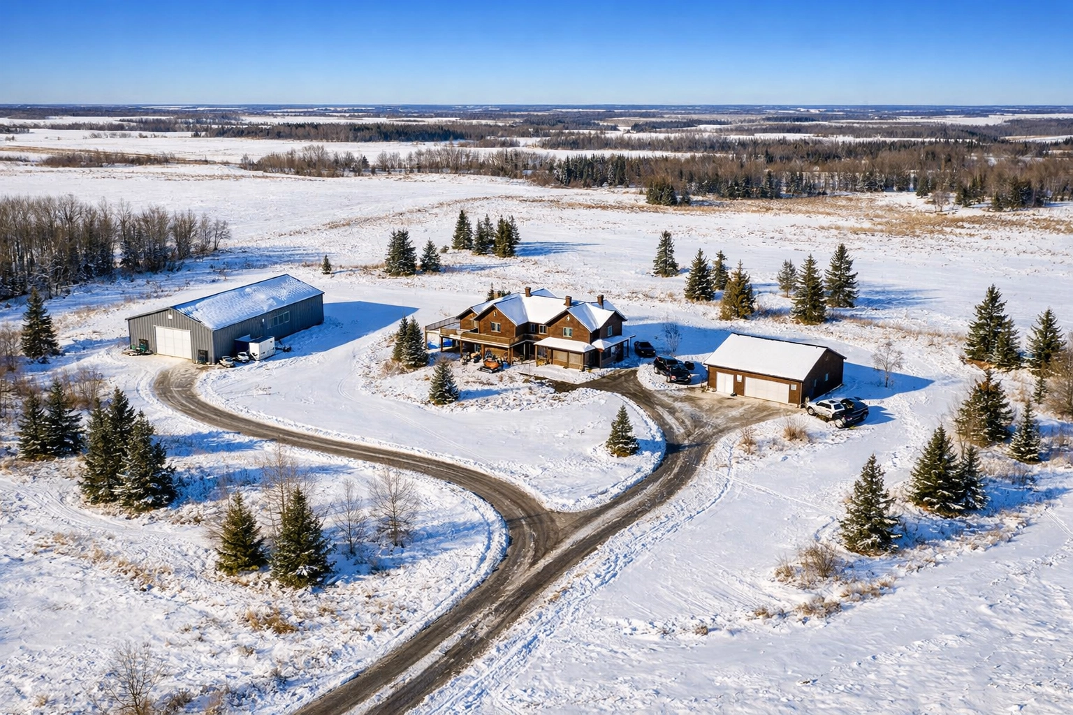 Winter aerial photograph of 5-acre acreage with multiple buildings in Saskatoon