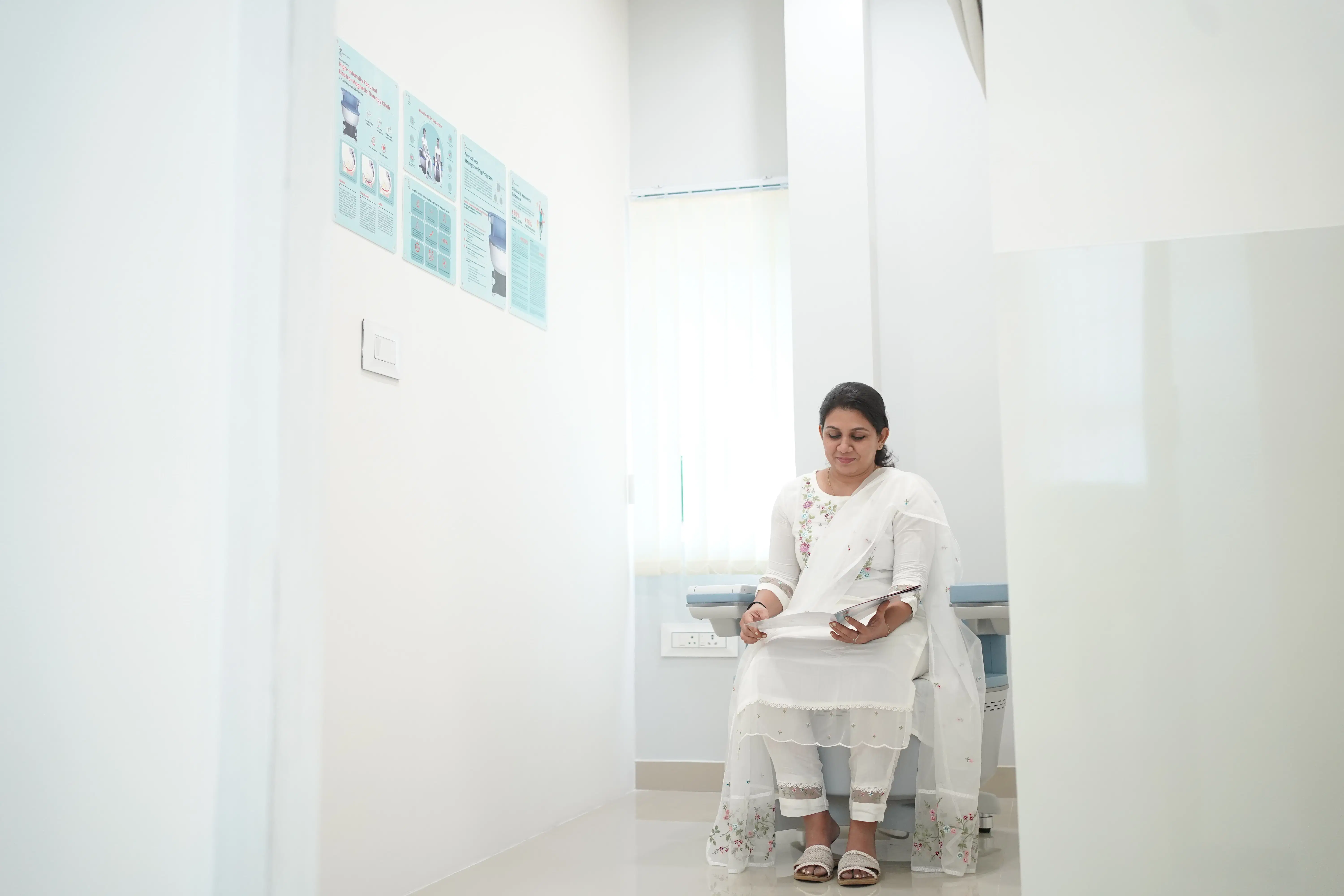 A female patient sits comfortably in a consultation room at Maana Health