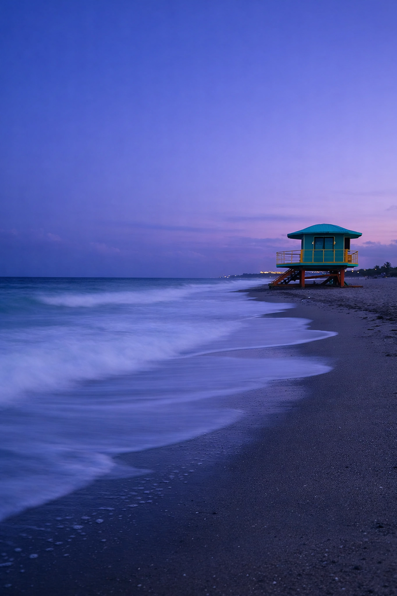 Fine art photography of a Miami Beach Art Deco lifeguard tower with long exposure waves for archival prints.