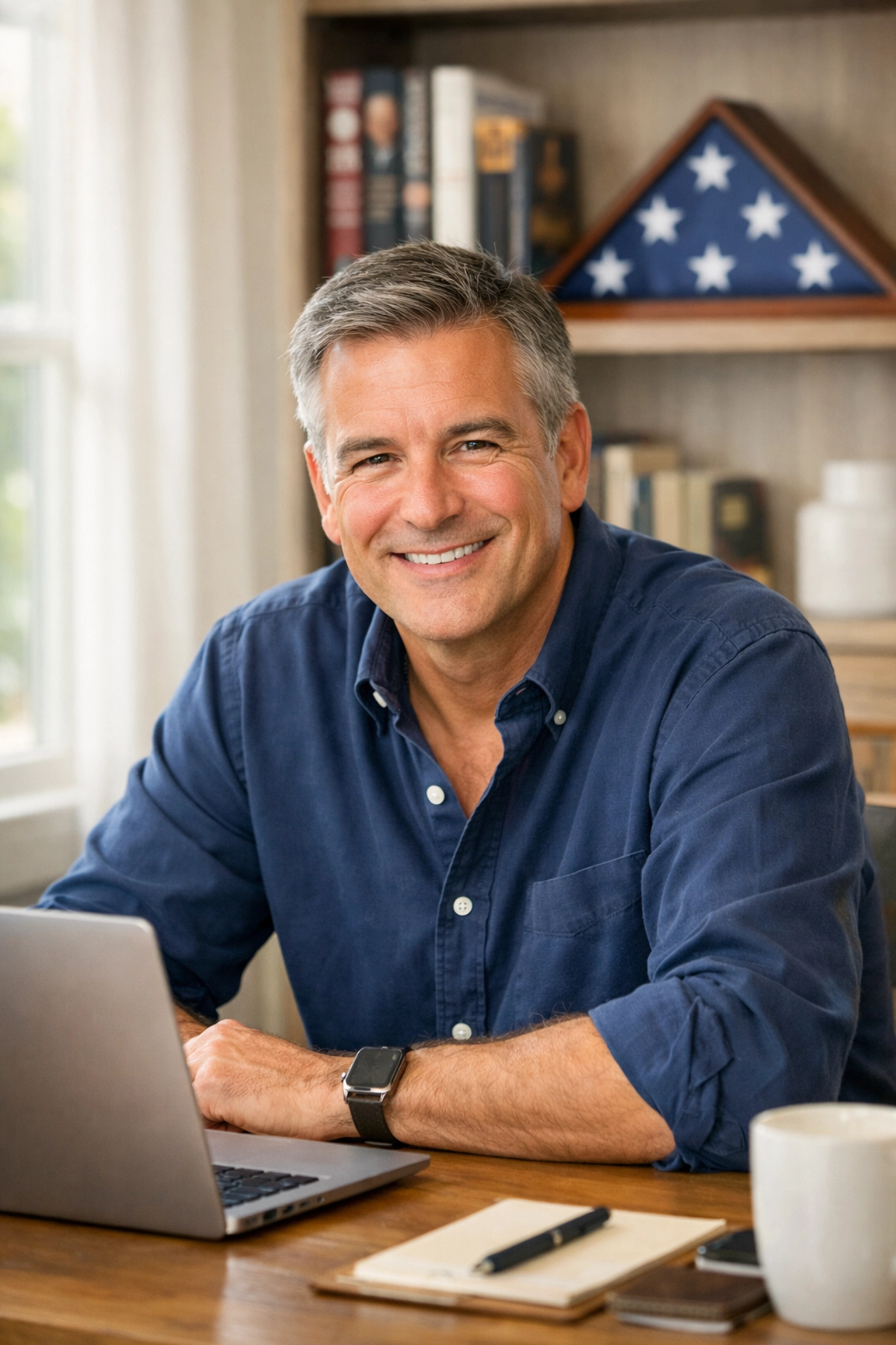 CEO Dan Kost writing a daily personal letter about leadership and American civic values in his office.