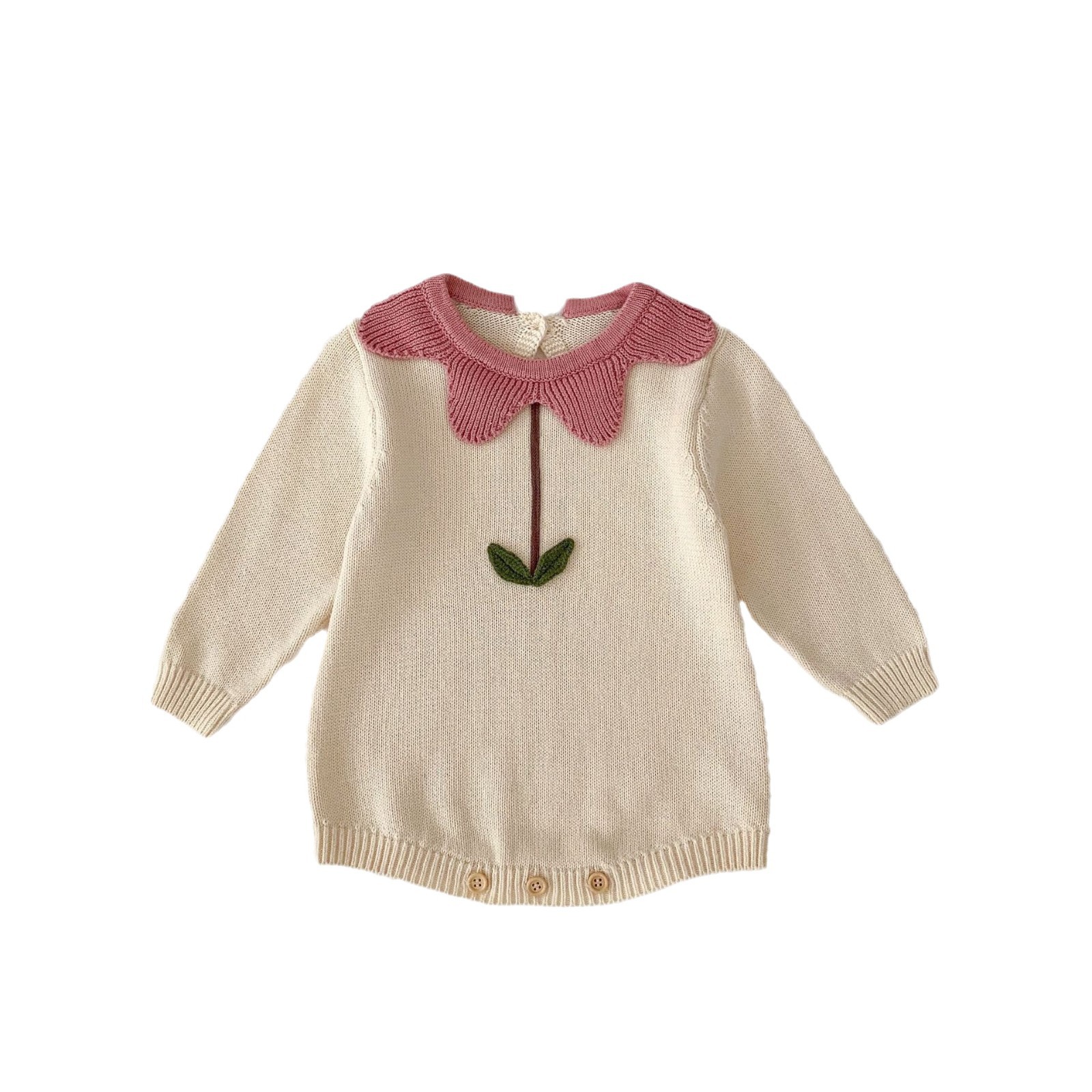 Cream baby sweater with a pink, flower-shaped collar and green leaf design. Three buttons at the bottom. White background. 





Elevate everyday style with the Flora Collar Romper. This beautiful knitted piece combines the ultimate one-piece convenience with a truly special detail: a delicate, floral-embellished collar. This elegant 3D floral appliqué adds a stunning touch of sophistication and texture, transforming a simple romper into a heirloom-quality outfit fit for christenings, birthdays, and unforgettable photos.


Crafted for both beauty and comfort, the romper itself is made from luxuriously soft, OEKO-TEX certified cotton. The snap closures ensure practical dressing, while the long sleeves and ribbed cuffs provide warmth and a perfect fit. The elegant neckline serves as the perfect frame for the gorgeous floral detail, creating a look that is both timeless and deeply charming.


This is the perfect union of practicality and special occasion style. It’s for the parent who wants their little one to look impeccably dressed with effortless ease, offering a look that is sure to draw compliments and create lasting memories.

 

Pattern: Solid knit with a 3D floral appliqué collar detail.

Color: Elegant solid color with contrasting floral elements.

Gender: Unisex.

Age Group: Newborn to 18 months.

Material: 100% OEKO-TEX certified cotton knit.

Pair With: Nothing else needed! This is a statement piece on its own. Pair with simple tights or bloomers for a complete look.

You Might Also Like: Apricot Blossom Knit Jacquard Set.

Flora Collar Knitted Long Sleeve Romper