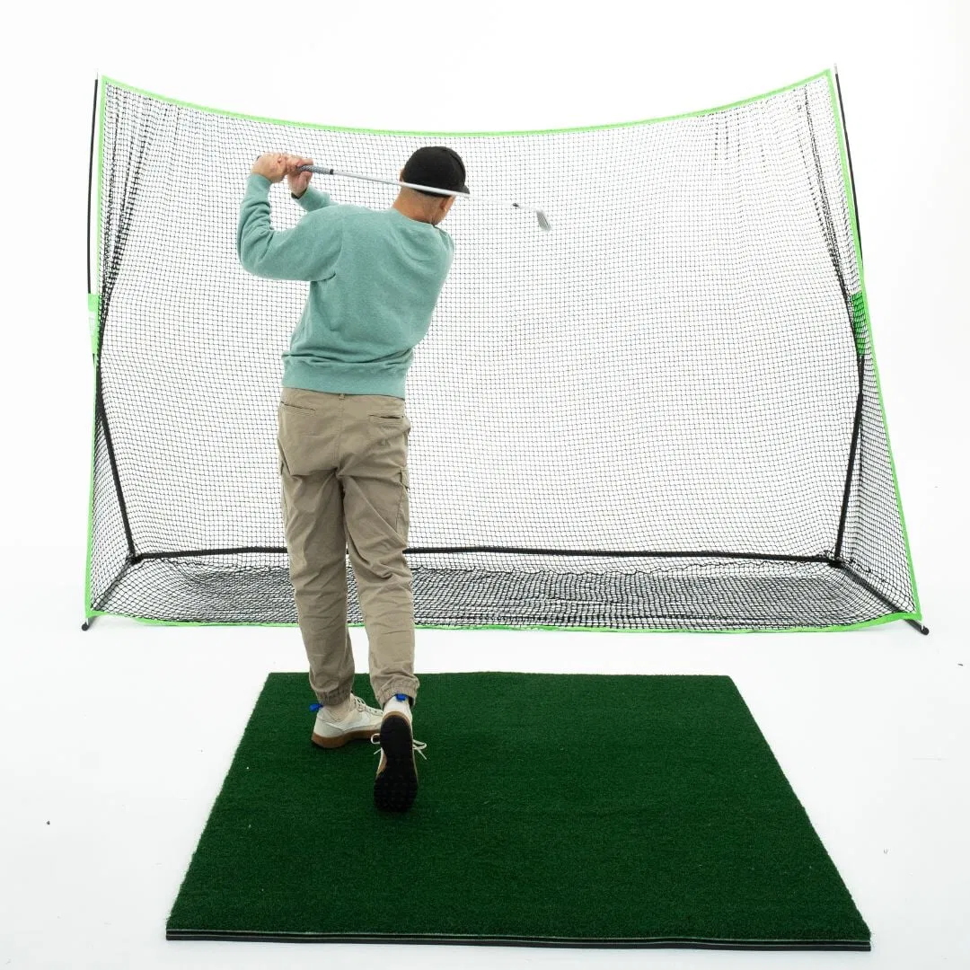 Golfer practicing in a protected enclosure