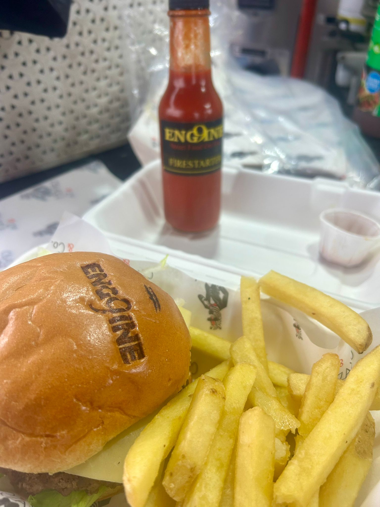 ENGINE burger meal with branded packaging