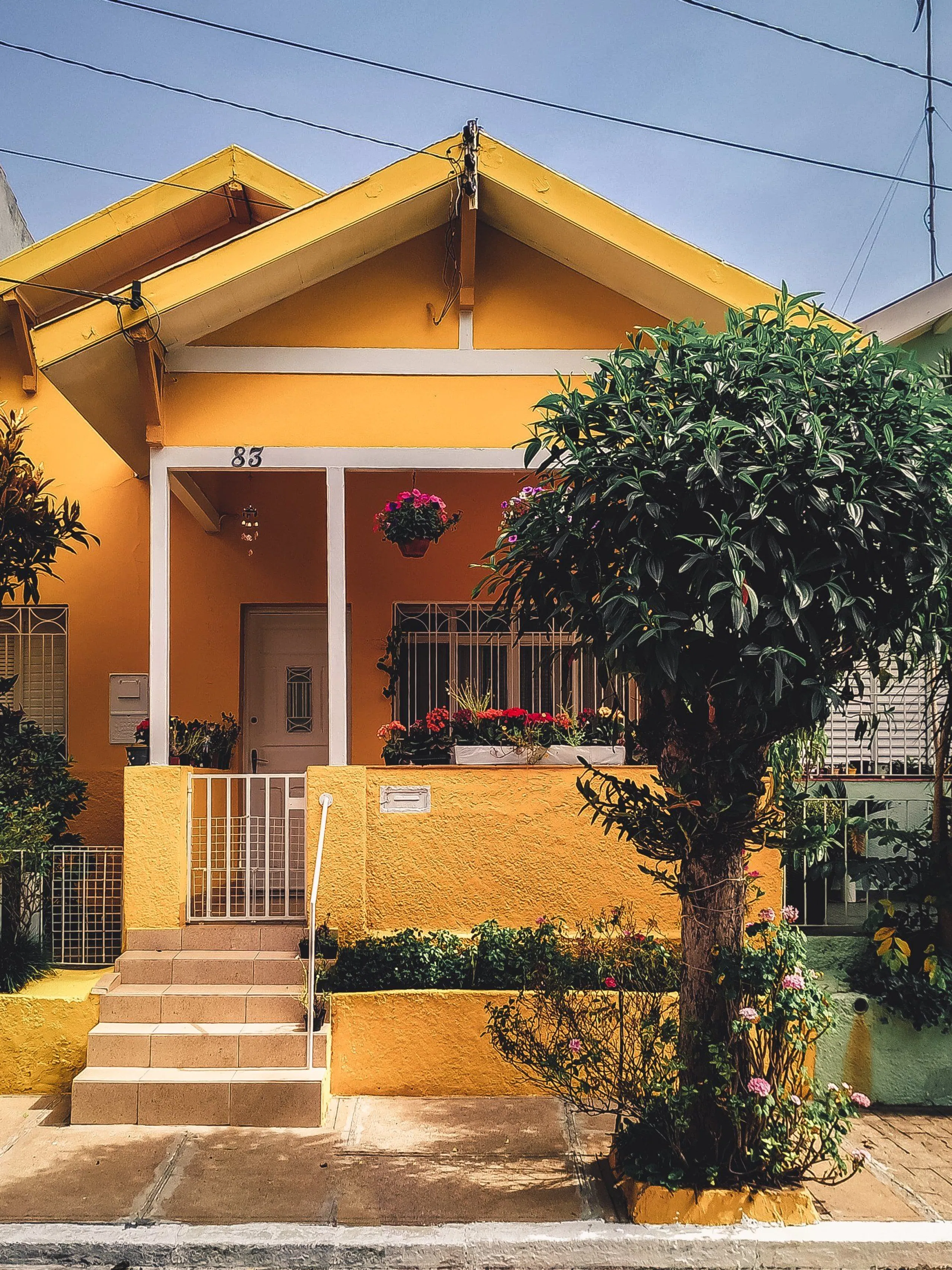 A modern, freshly painted yellow house