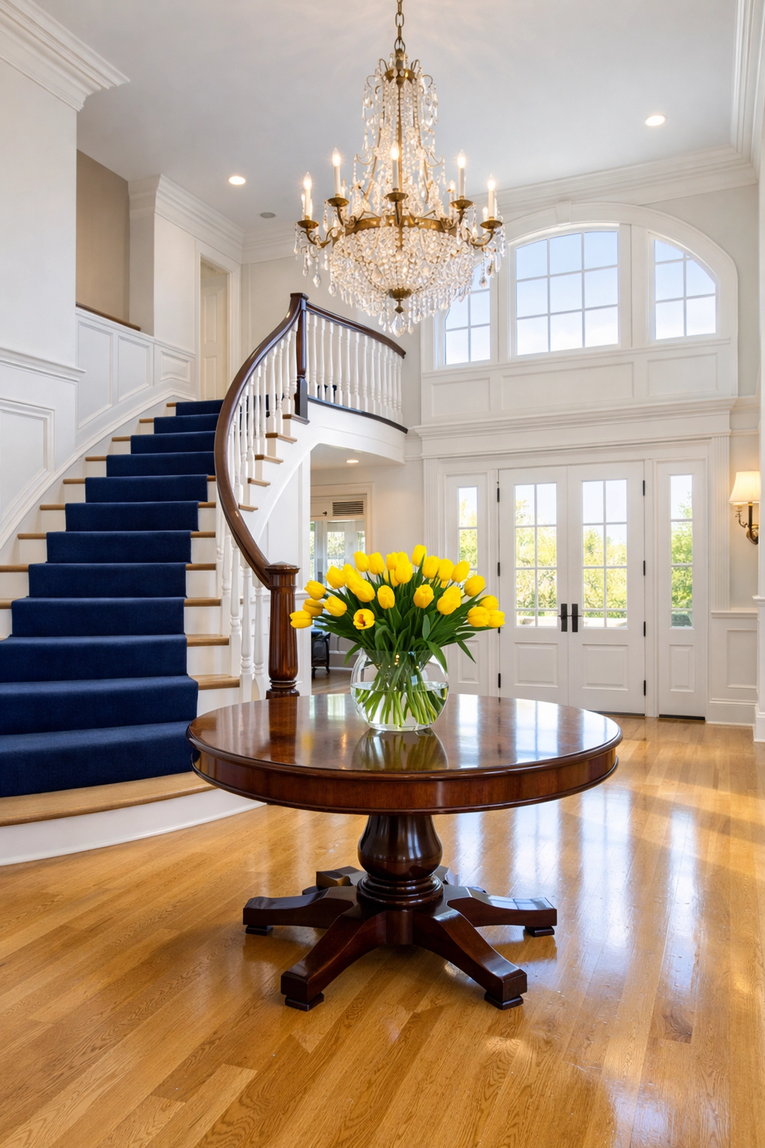 Grand foyer of a Hamilton estate featuring polished floors maintained by premium luxury cleaning services.