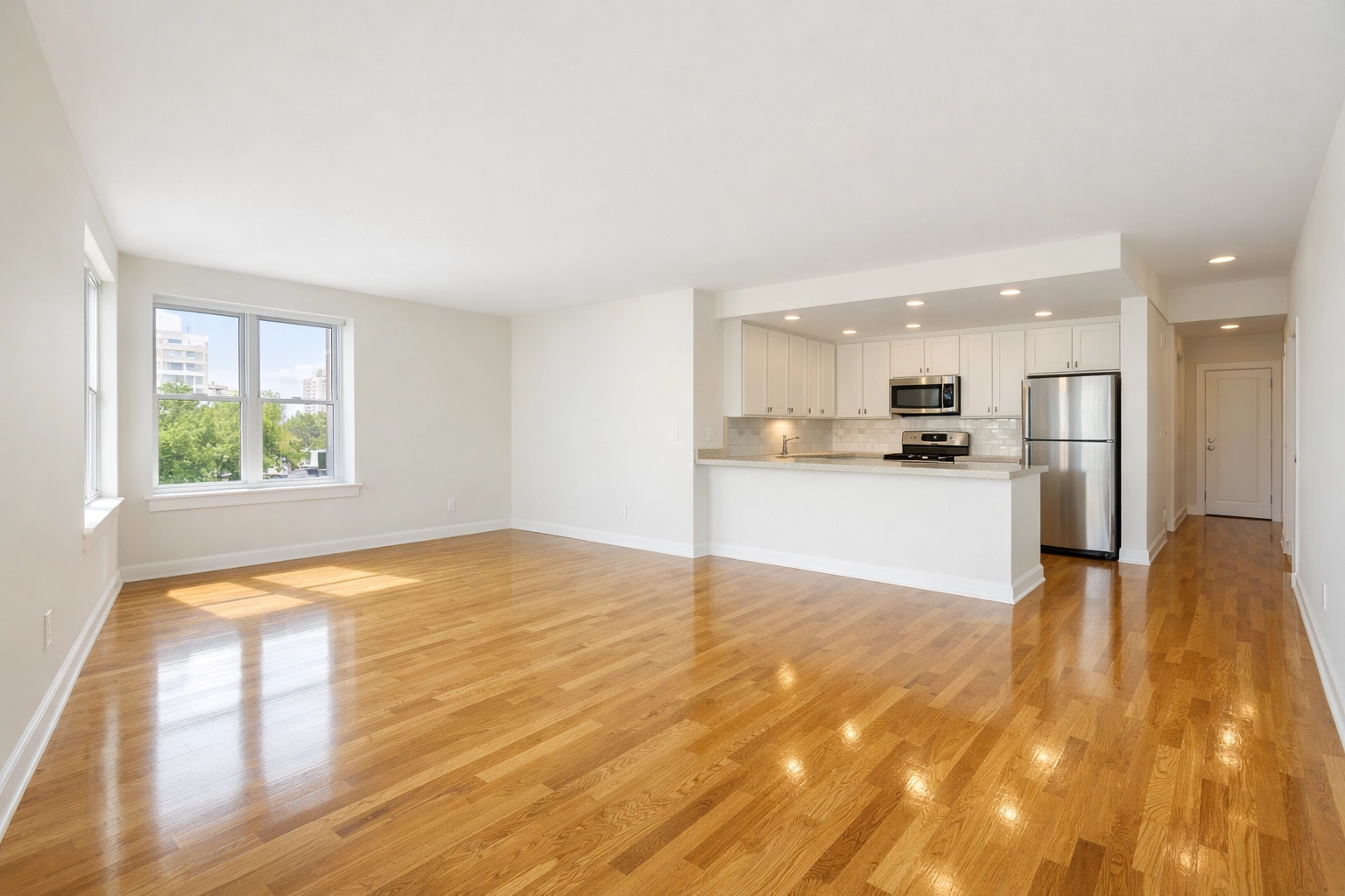 Freshly cleaned empty apartment with polished floors ready for property turnover