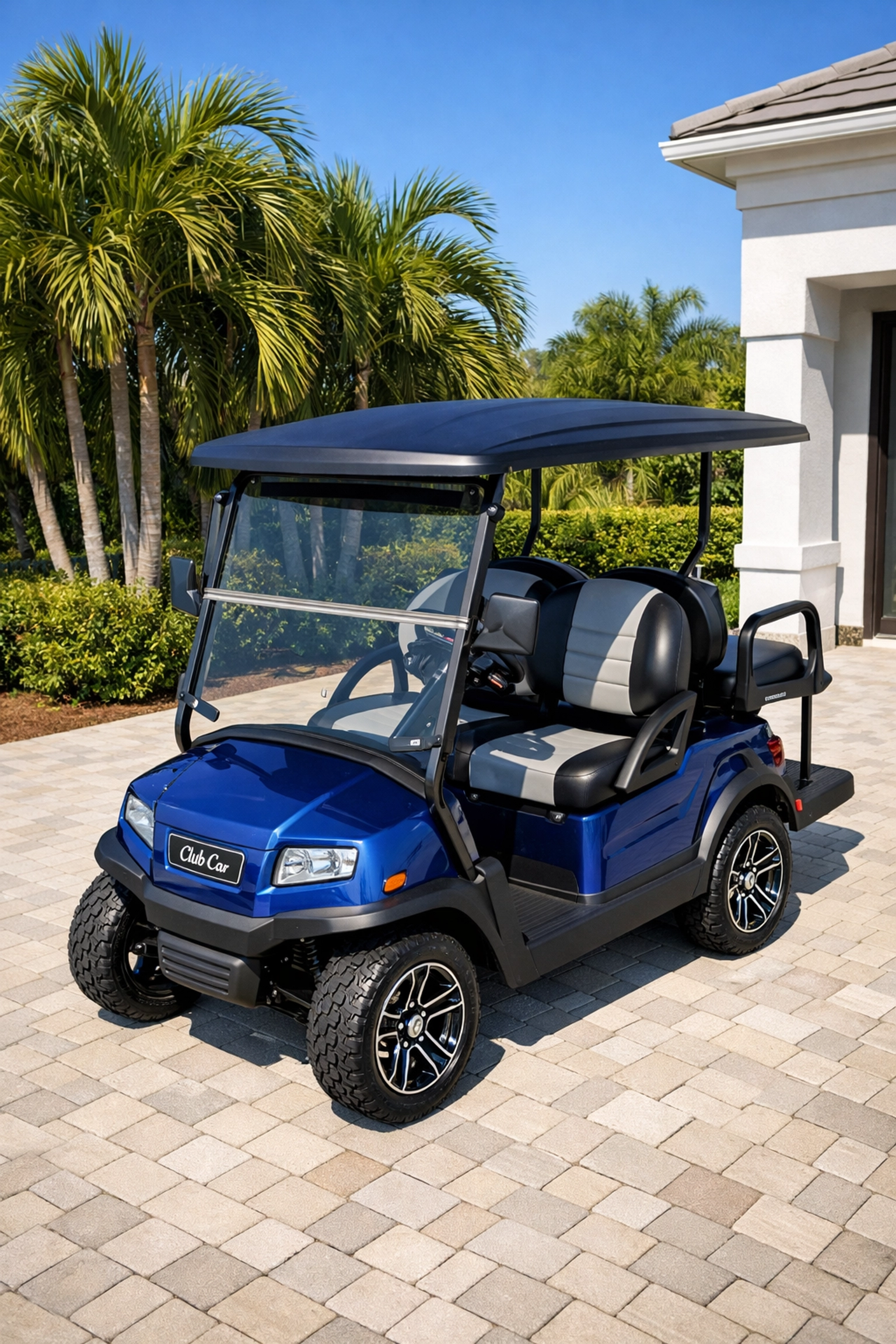 Premium blue Club Car Onward on a Venice driveway, a top choice for golf carts for sale venice fl.