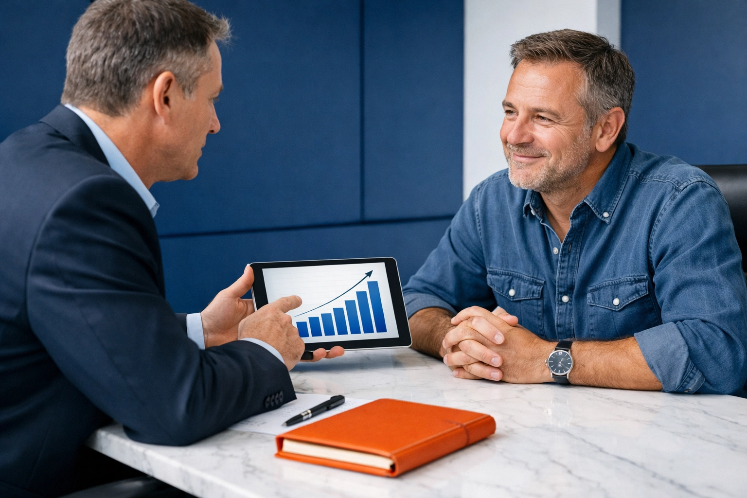 Business advisor and owner reviewing a growth chart to prepare for a $5M exit strategy.