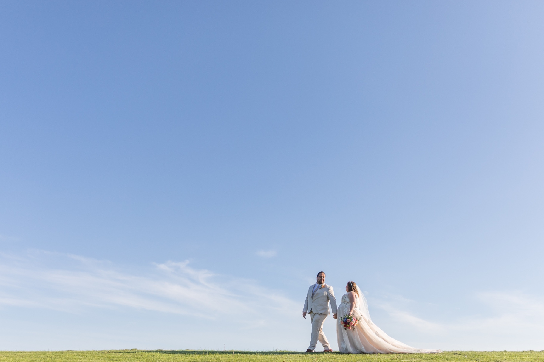 A celebratory wedding-day detail—soft light, warm tones, and a finishing touch that feels like them