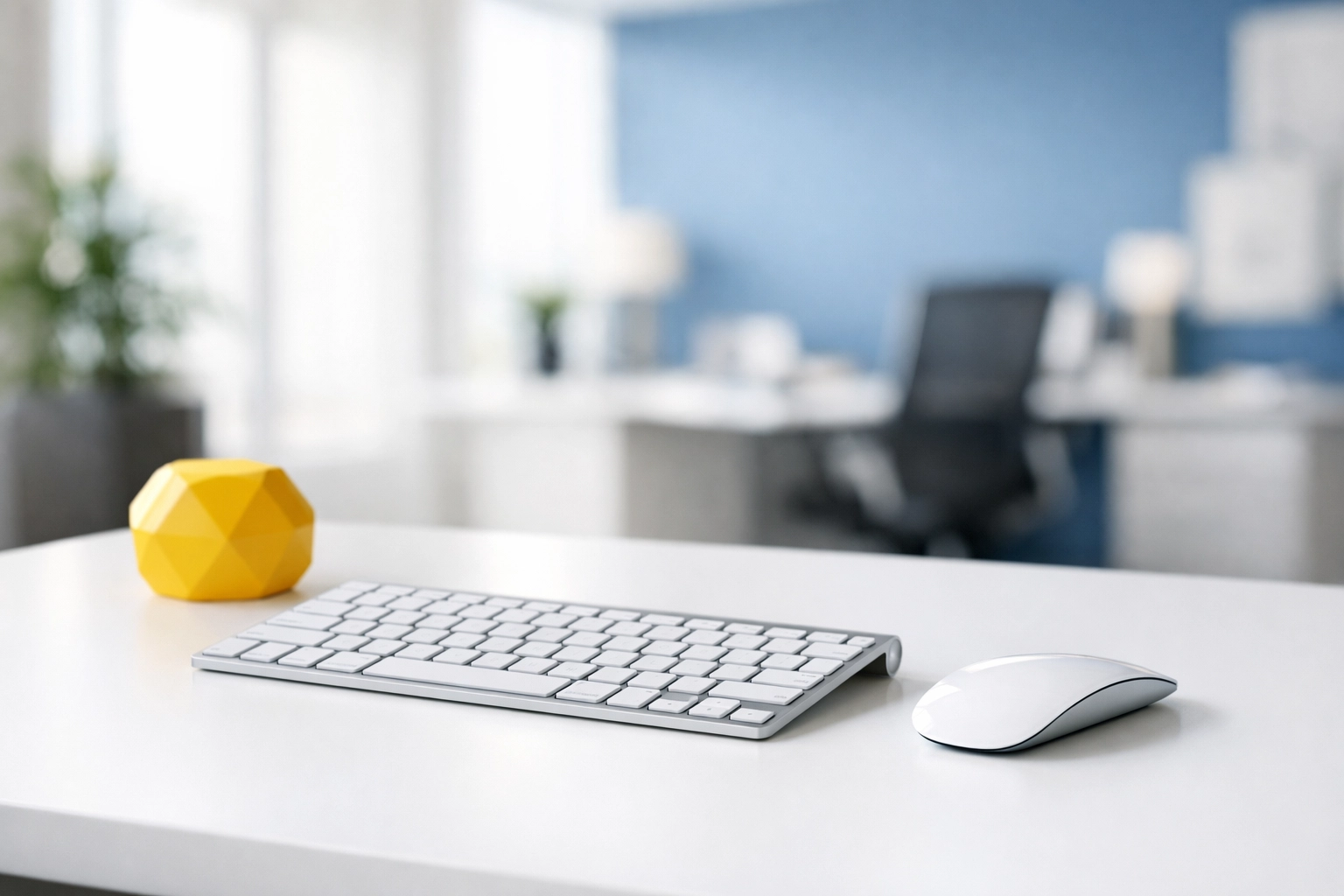 A clean, dust-free minimalist workstation in a Littleton office featuring a sanitized keyboard and mouse.
