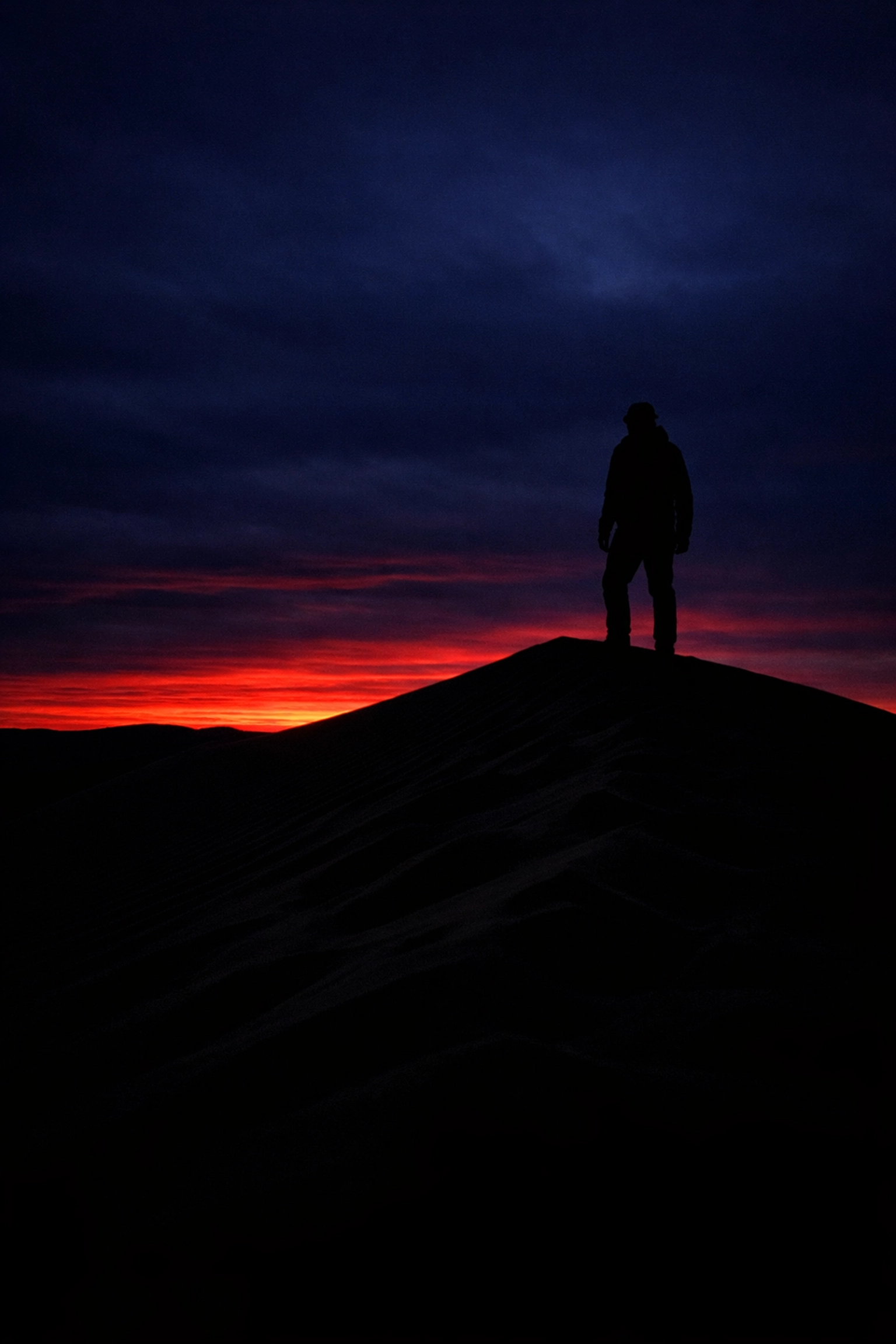Sunset silhouette on a sand dune showing creative exposure control when mastering manual mode.