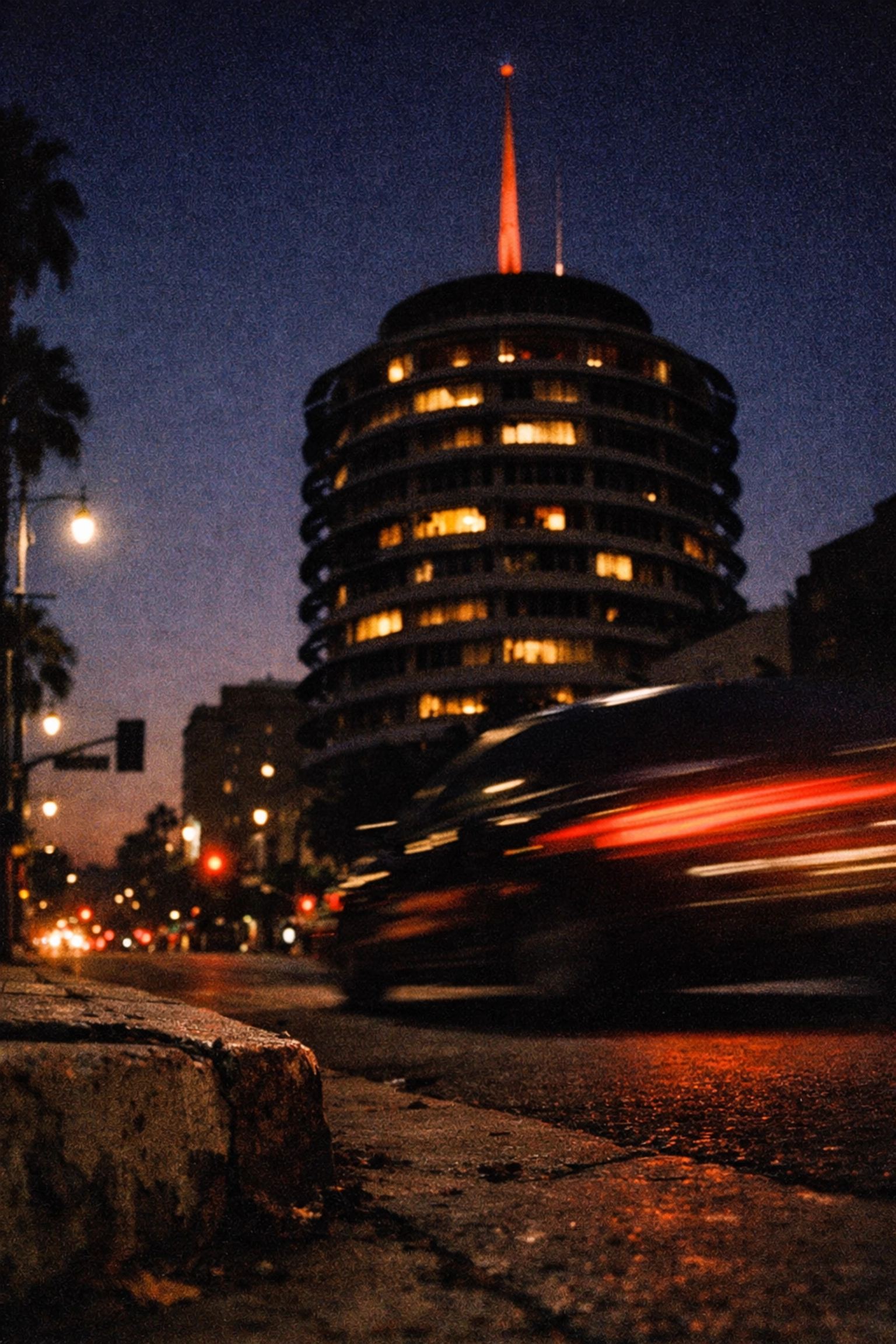The historic Capitol Records Building at dusk, a legendary Los Angeles recording studio near Hollywood Boulevard.