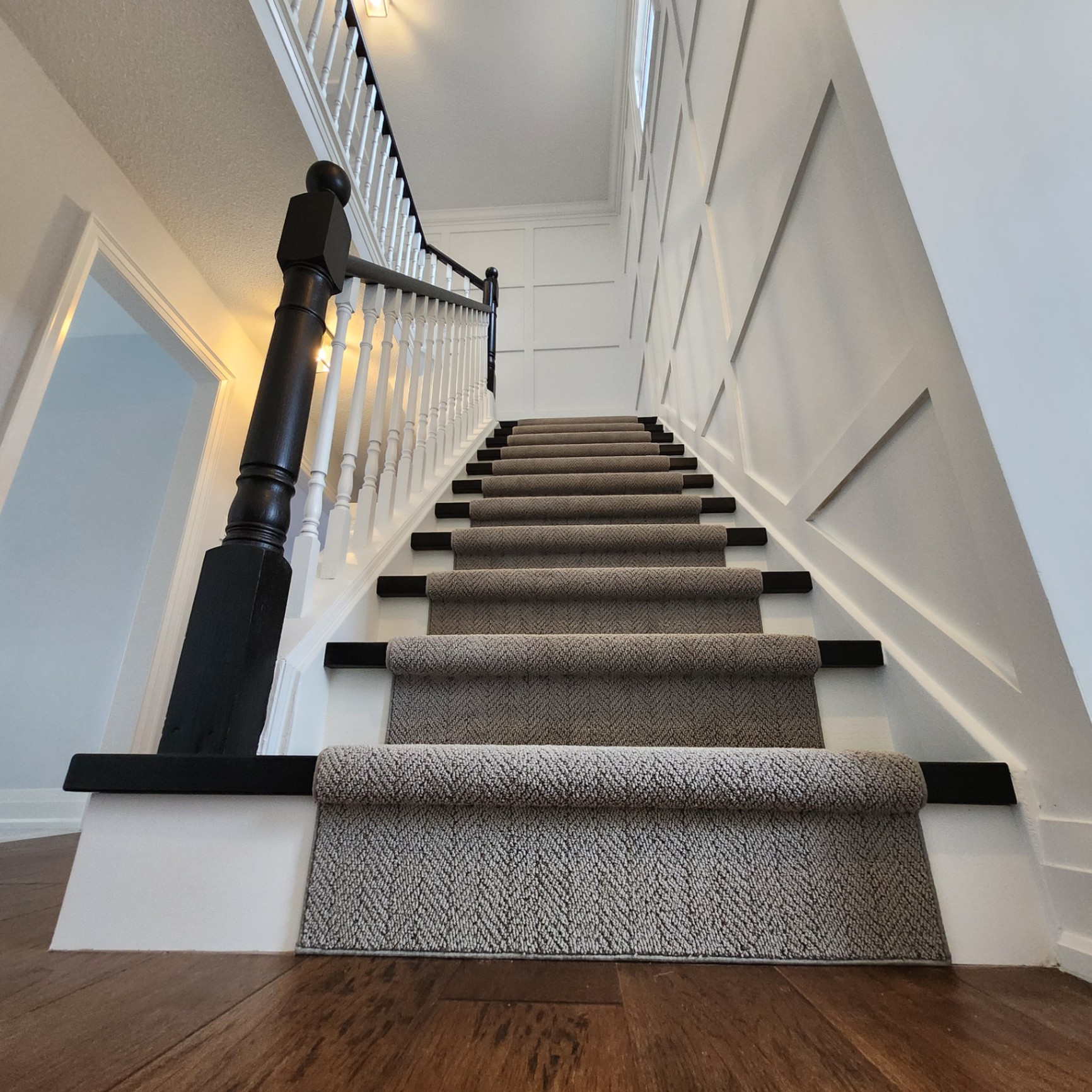Custom Staircase Renovation with Wainscoting