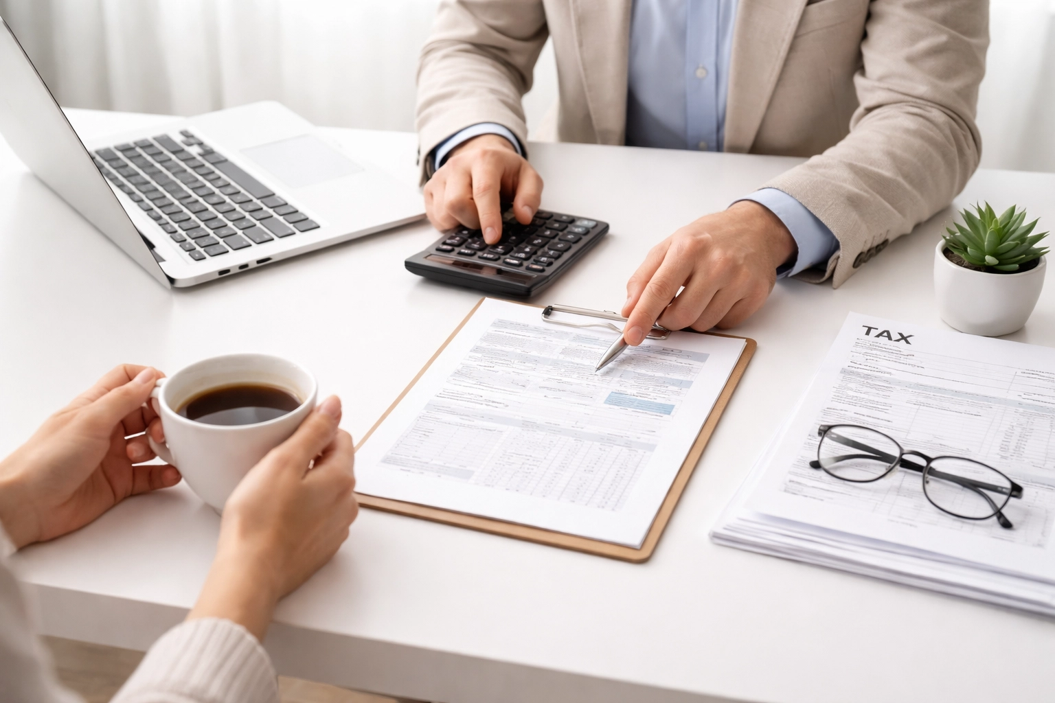 Tax professional and client discussing documents, highlighting trusted tax preparation for new laws