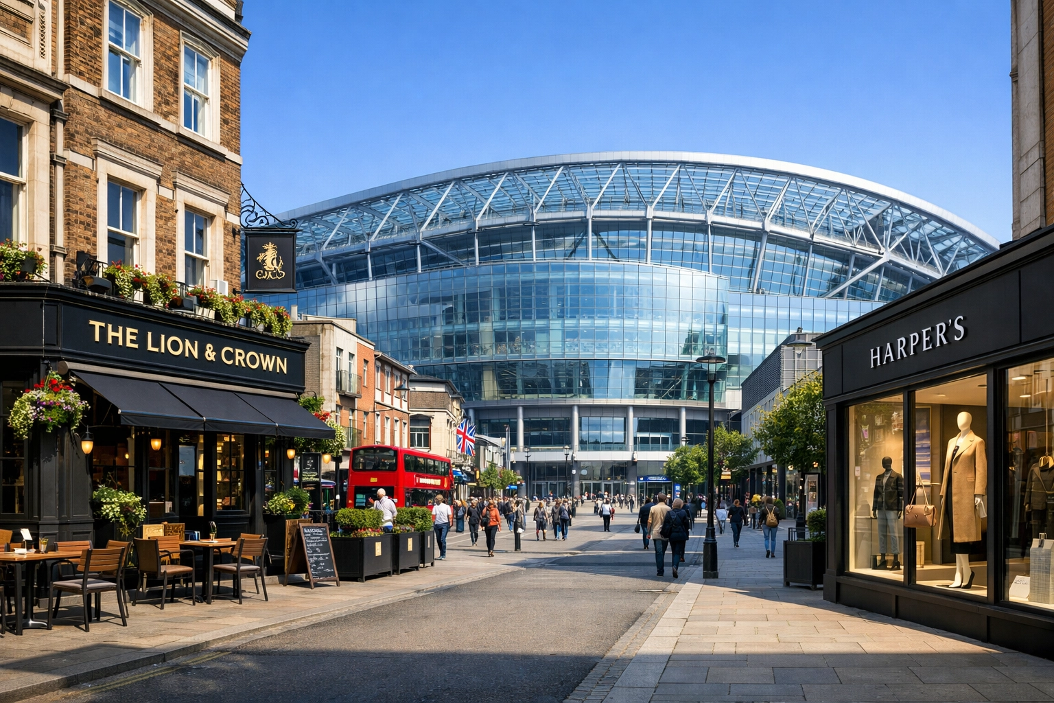 A UK city street showing a pub and a stadium representing Martyn's Law Standard and Enhanced tiers.