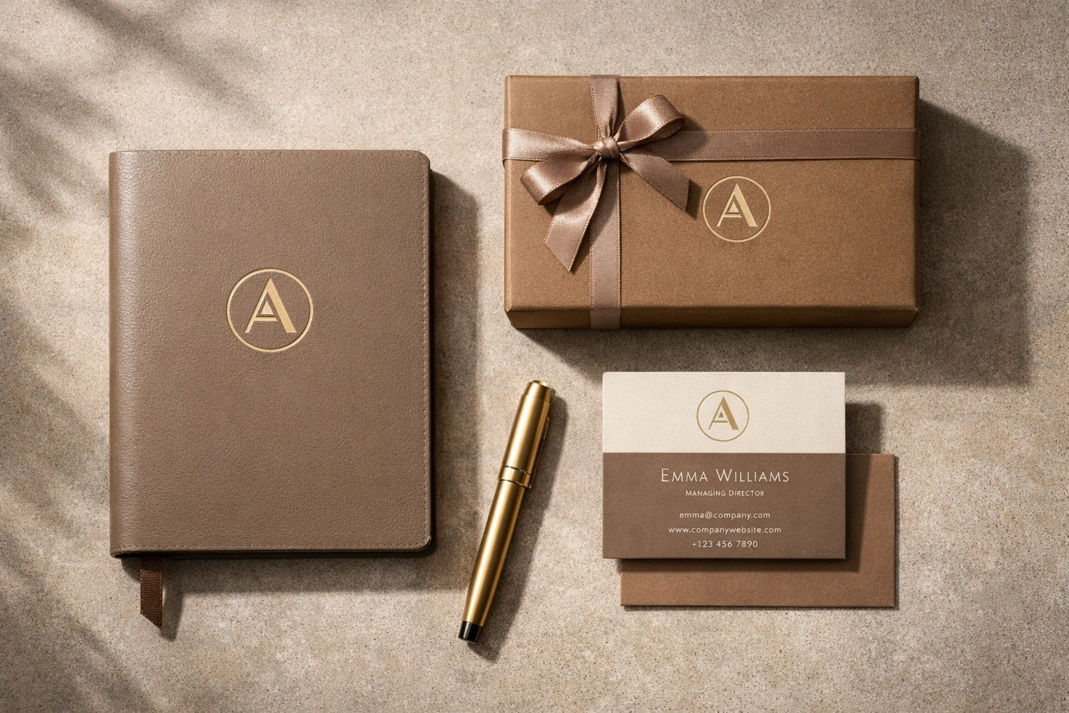 Professional brand kit flat-lay featuring high-quality printed business materials and gift boxes.