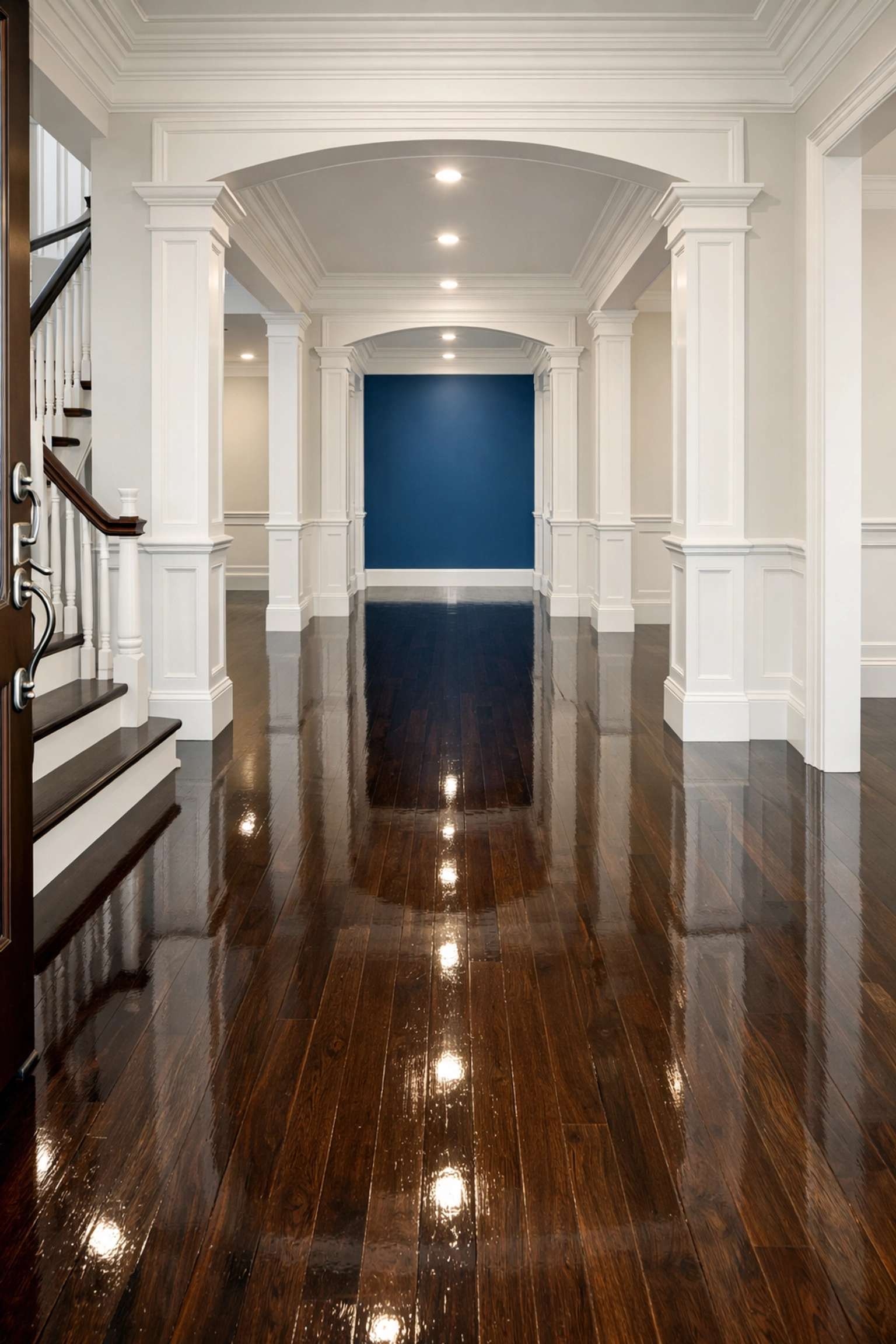 Gleaming hardwood floors in a luxury Dedham home foyer following a professional deep cleaning.