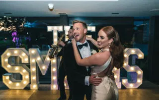 Newlyweds sharing their first dance in a lively, elegant celebration at The Colony Wilmslow