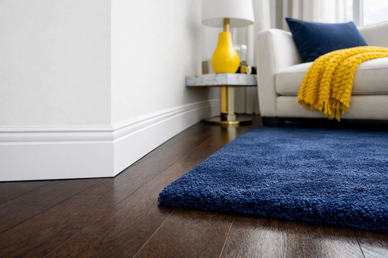 Dust-free living room corner in Lancaster MA showcasing high-end house cleaning and spotless baseboards.