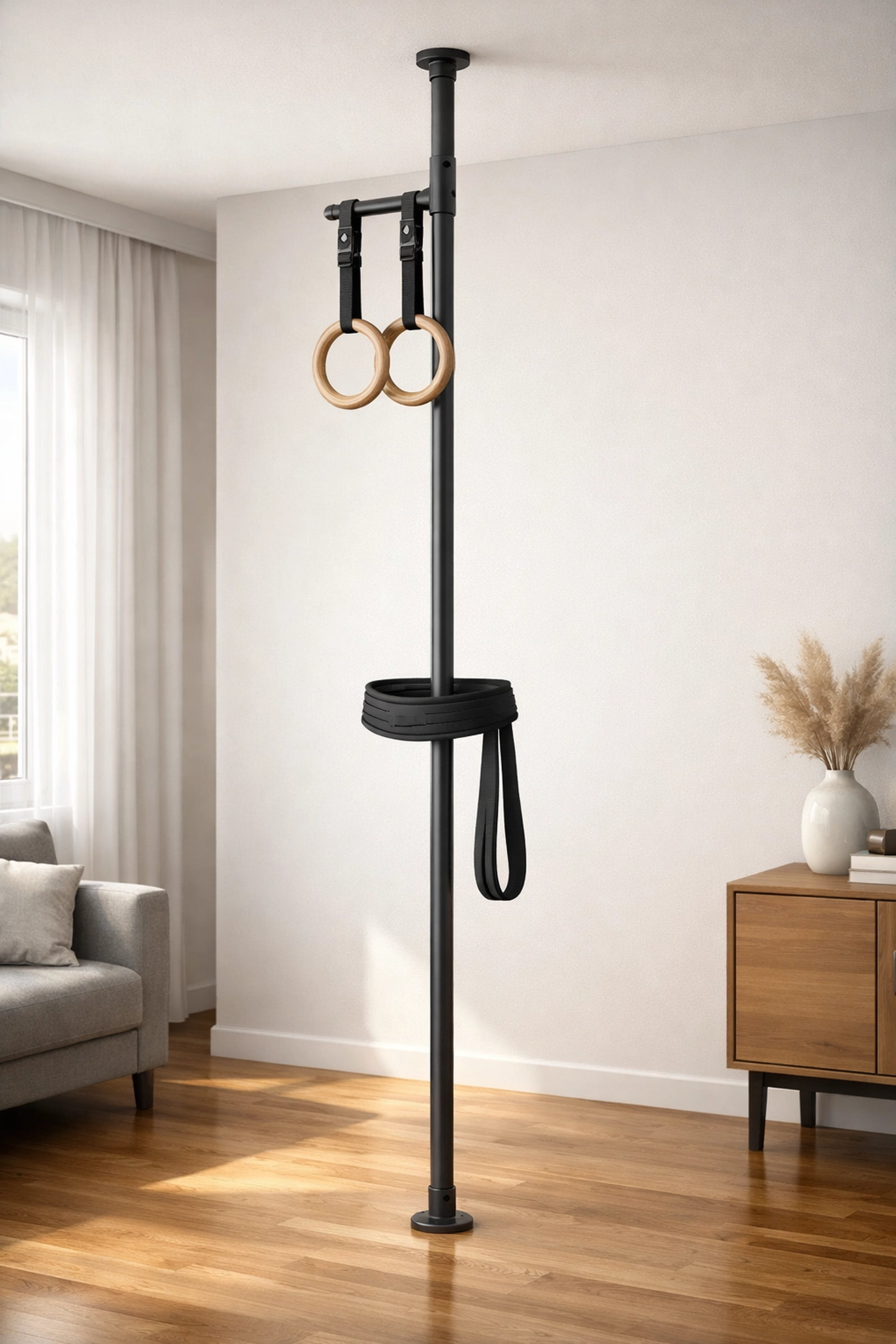 Floor to ceiling gym system for apartments with gymnastics rings and resistance bands.