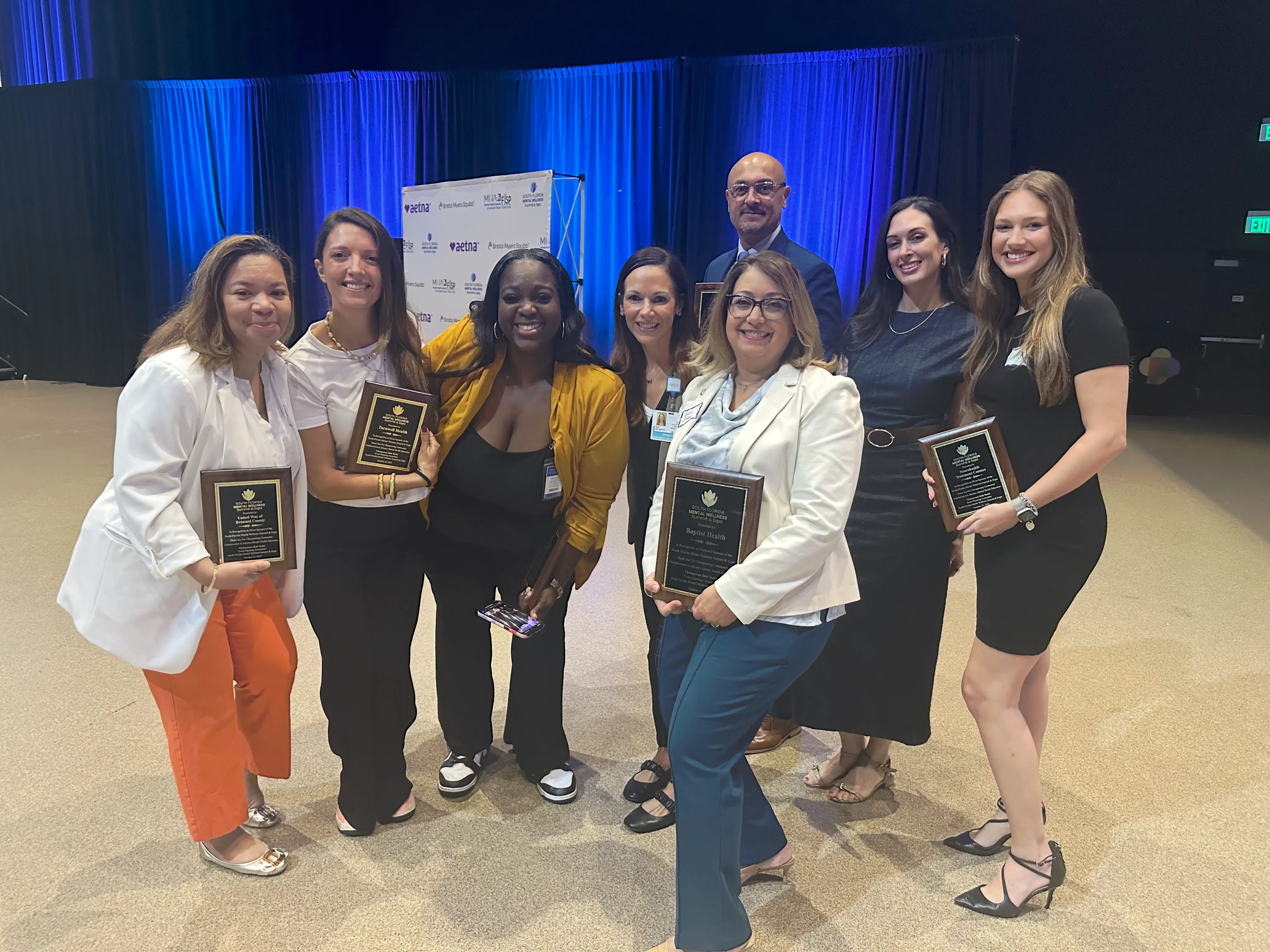 Mental health providers and community members networking at the South Florida Wellness Summit.