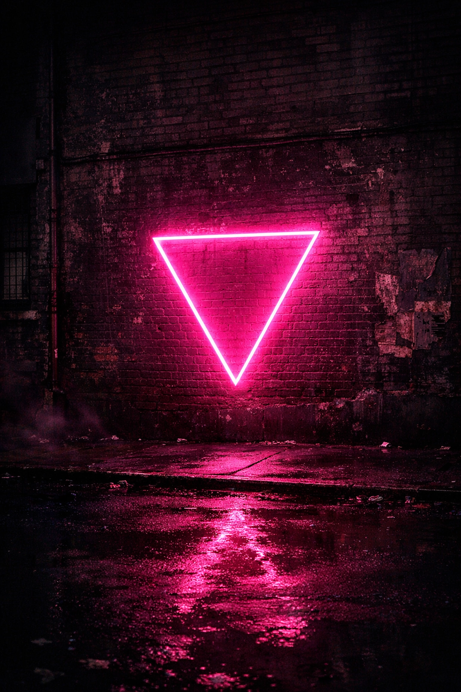 Neon pink triangle on a dark brick wall symbolizing the reclamation of LGBTQ symbols during the AIDS crisis.