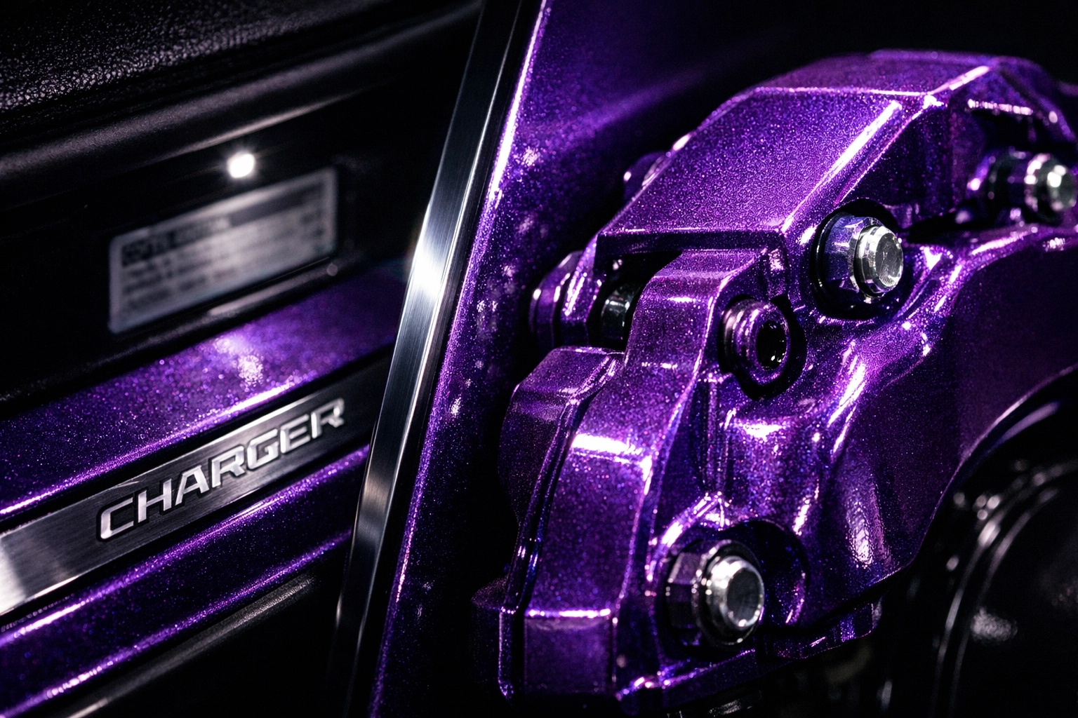Custom powder coated Plum Crazy brake caliper matching the Dodge Charger factory paint code on the door jamb.