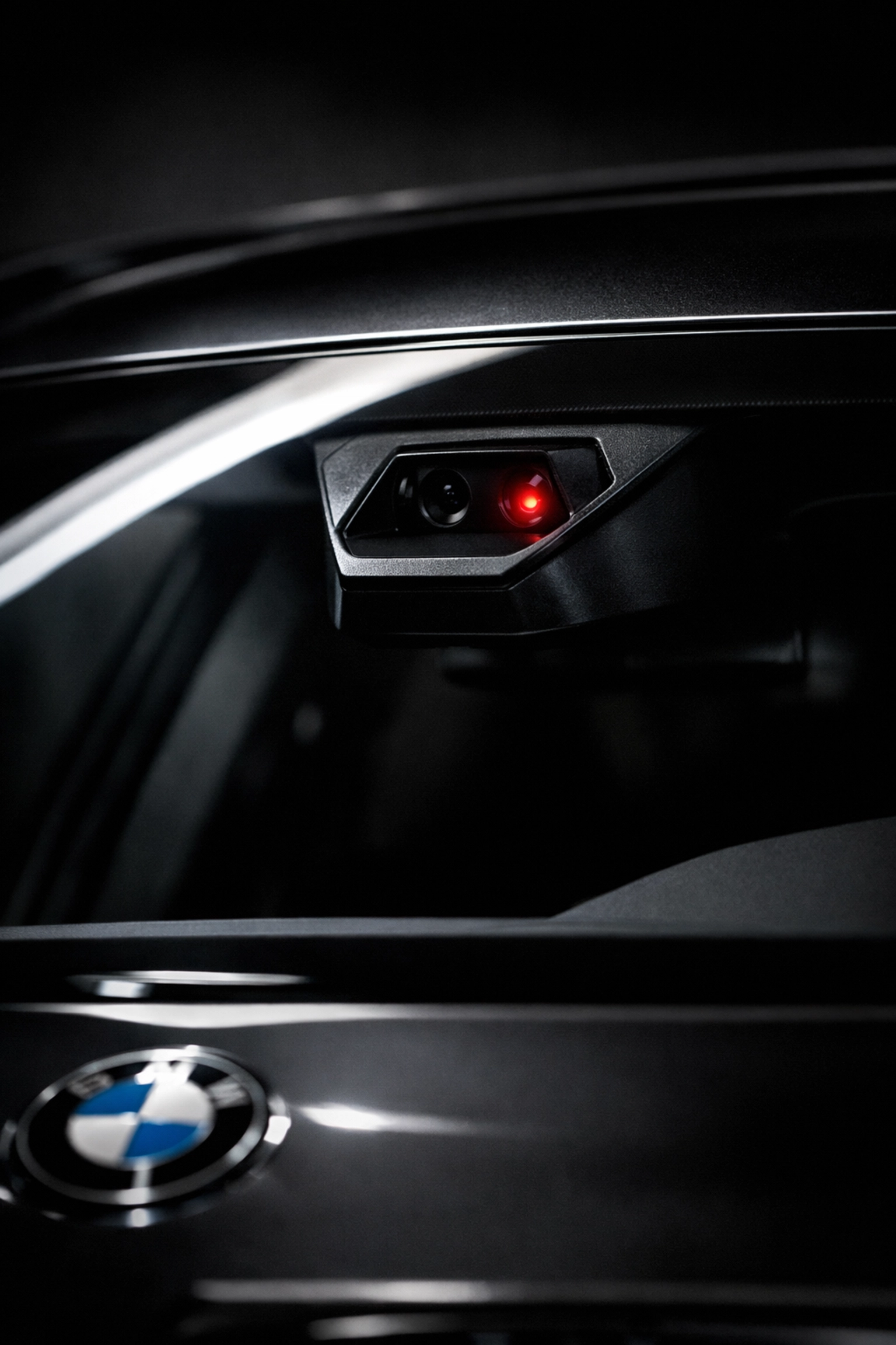 BMW windshield-mounted ADAS camera housing highlighting the need for specialized calibration equipment.