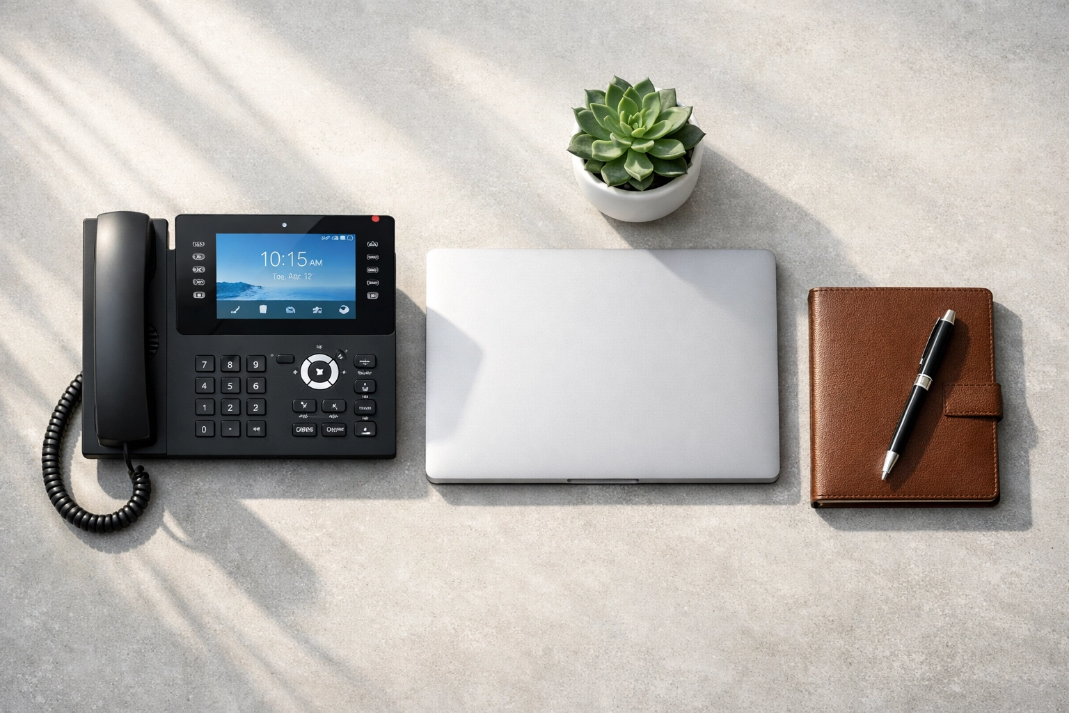 Top-down view of a high-definition IP phone, part of a professional business phone system setup checklist.