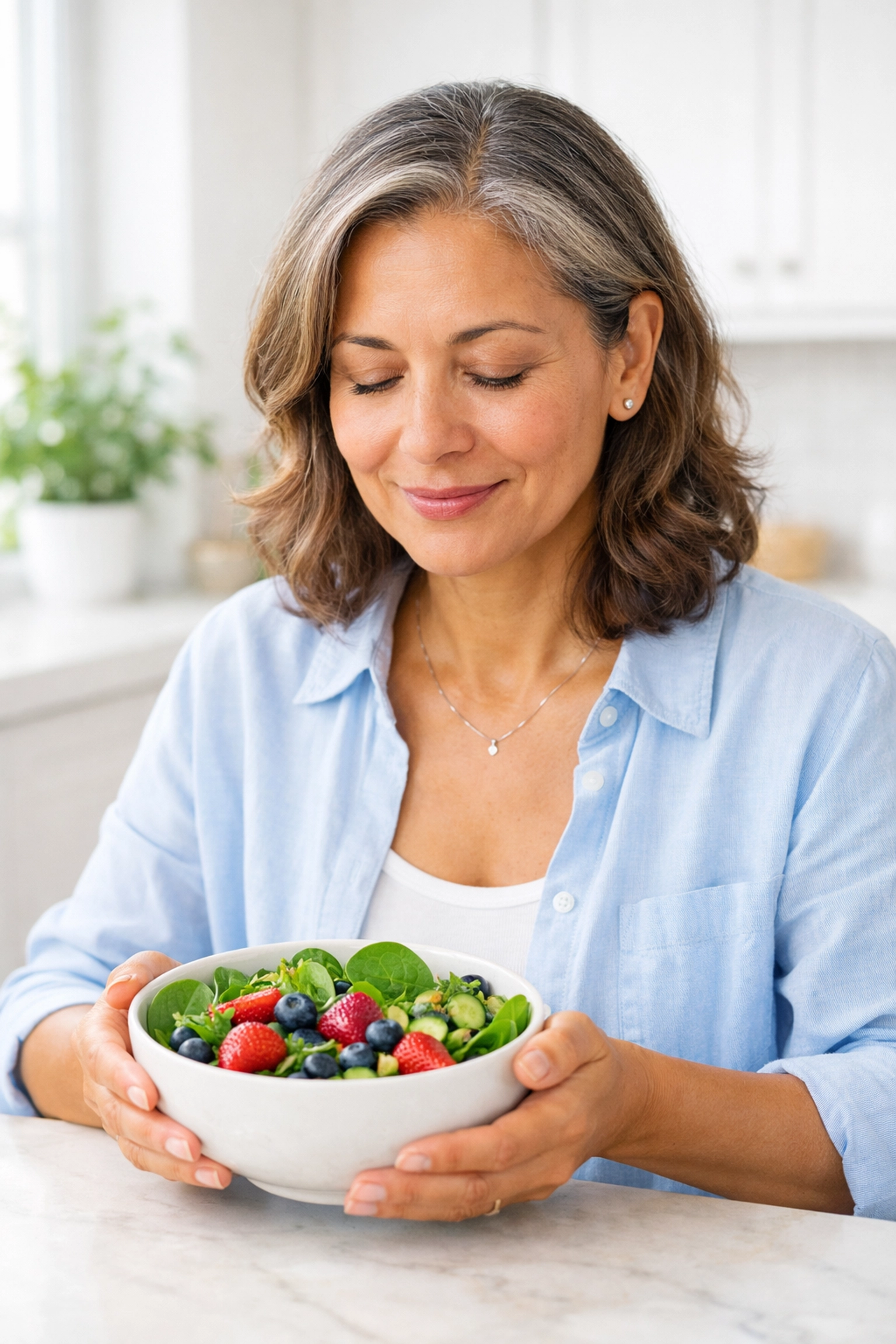 A woman enjoying a healthy meal, representing the reduction of food noise with Tirzepatide treatment.