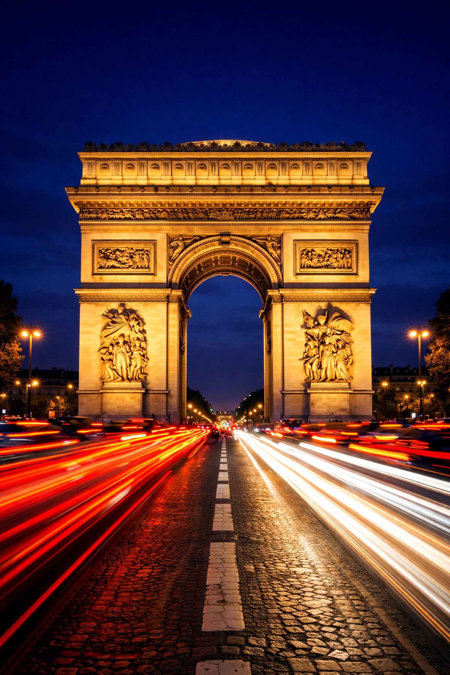 Top 10 Instagrammable Places in Paris That Aren’t Just the Eiffel Tower 5 Arc de Triomphe at night with light trails, demonstrating travel photography tips for iconic landmarks.