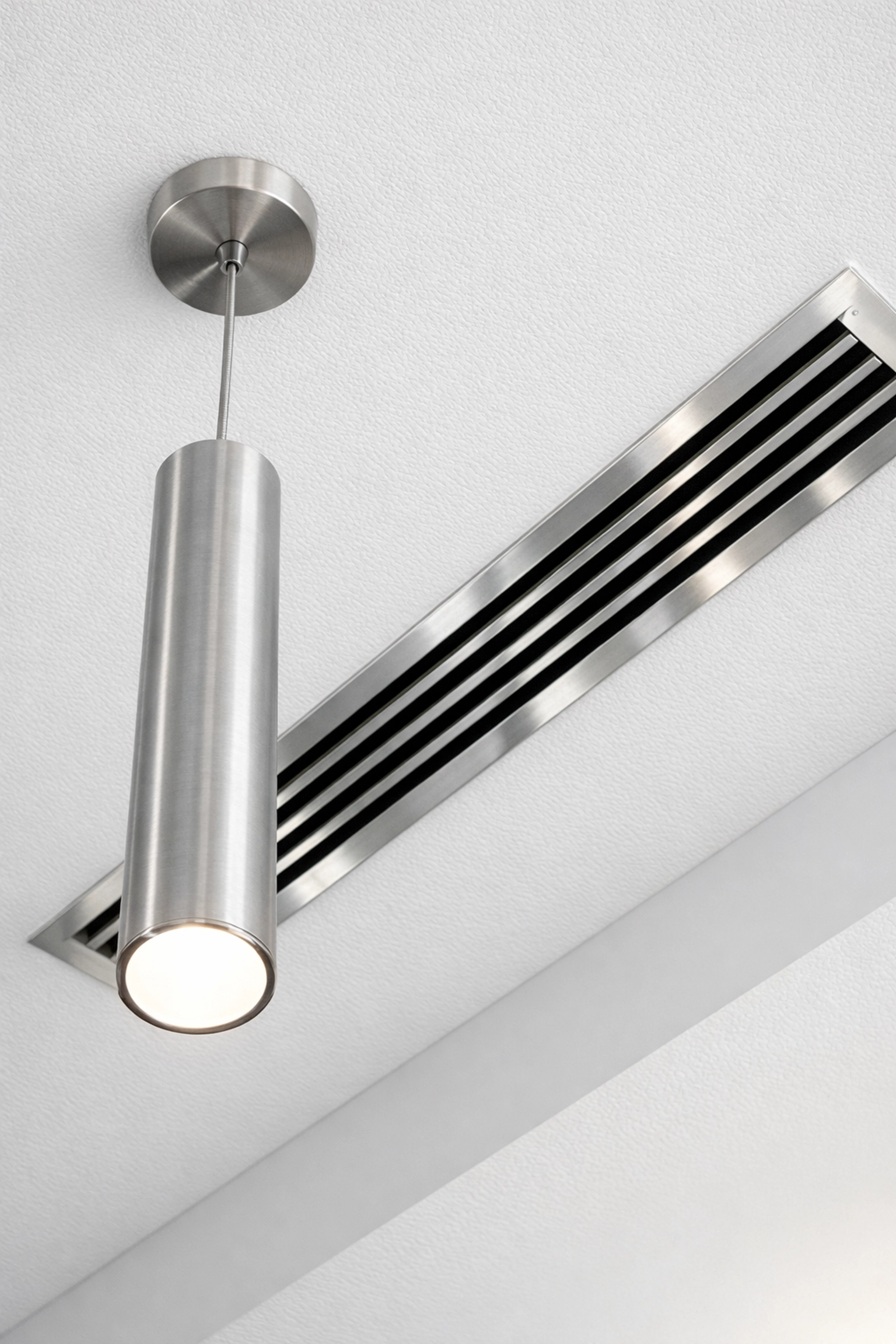 Clean ceiling vent and modern light fixture in an Indianapolis office illustrating deep cleaning standards.