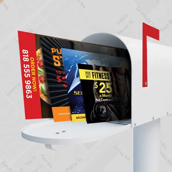 white-mailbox-with-colorful-flyers-direct-mail-marketing.webp