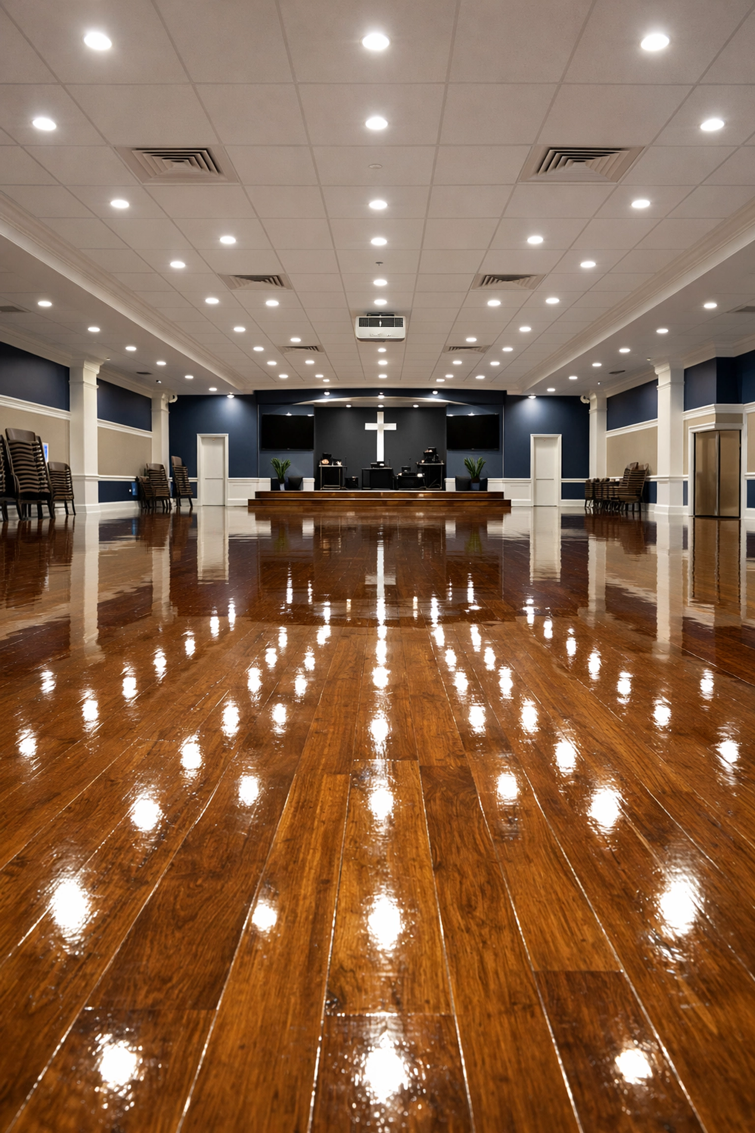 Highly polished hardwood floors in a modern church fellowship hall in Lawrence.