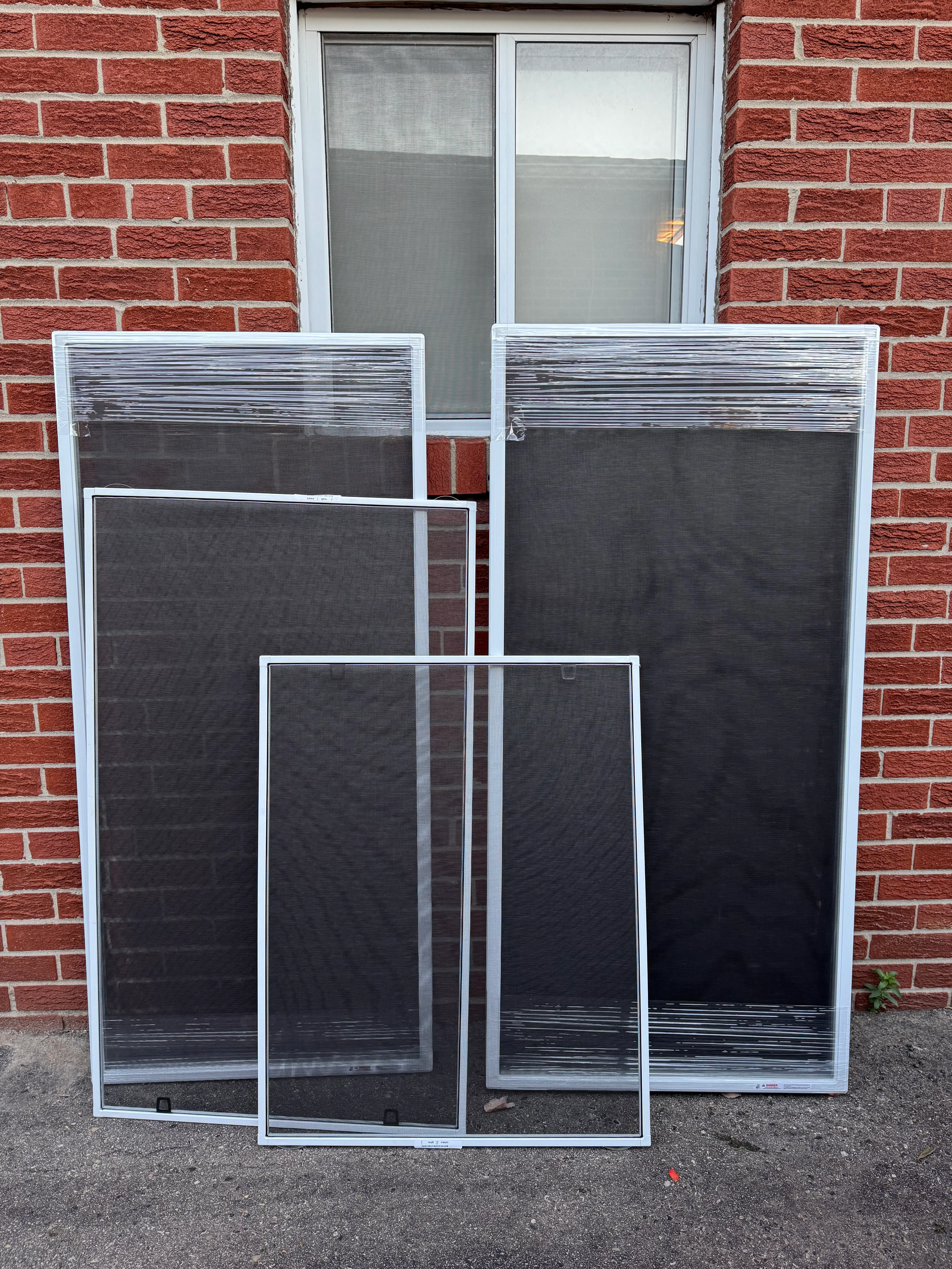 Custom-made window screens ready for residential installation in the GTA