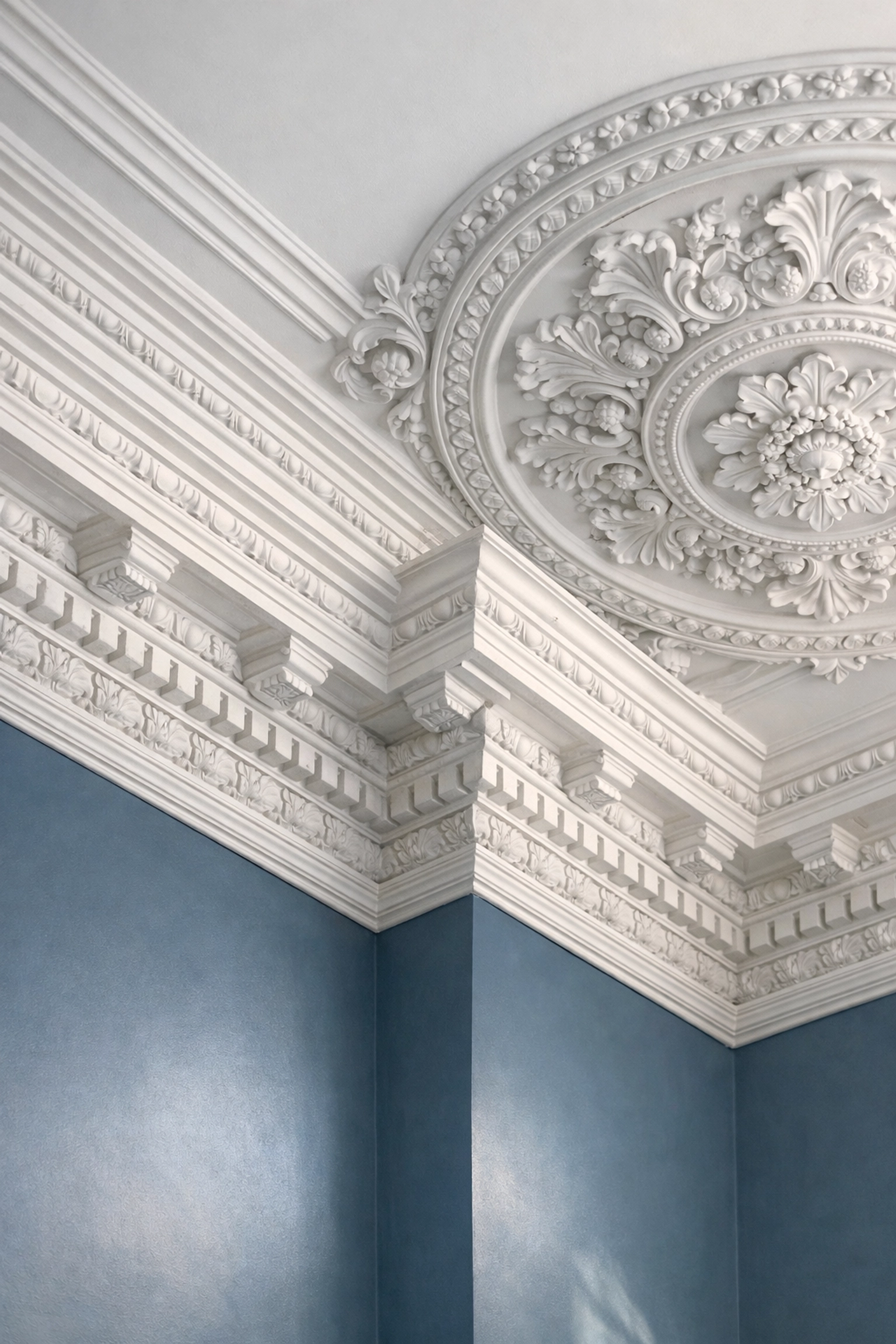 Detailed plaster crown molding in a historic home after luxury house cleaning in Brookline.