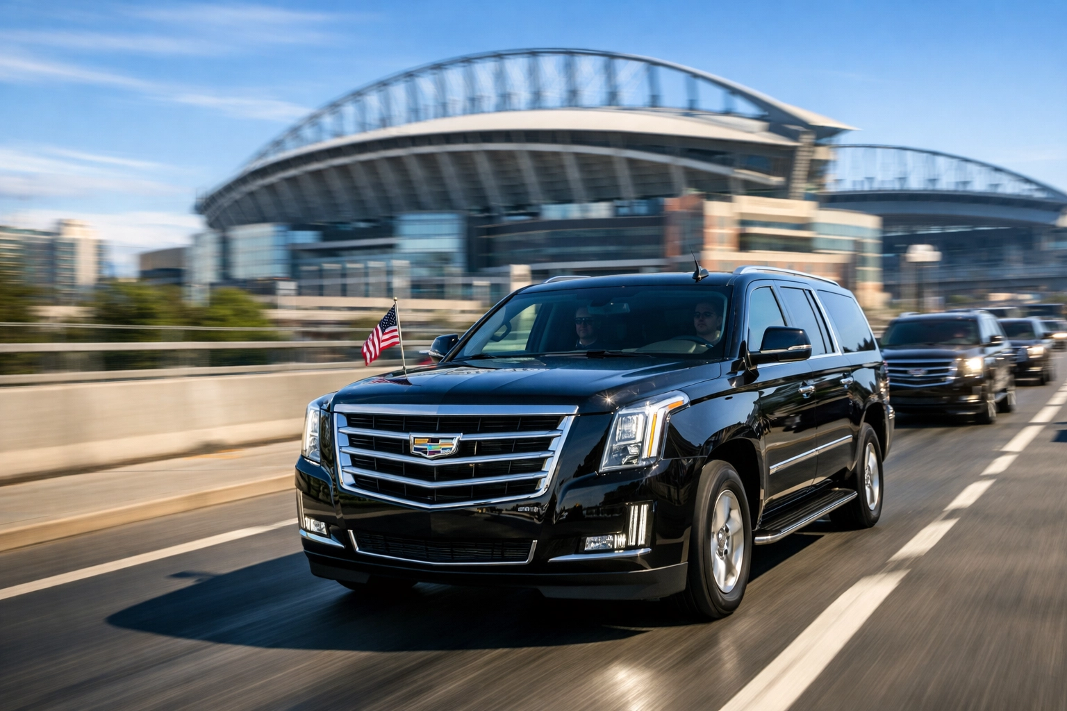 A motorcade of black luxury SUVs bypassing traffic for precision Super Bowl event logistics.