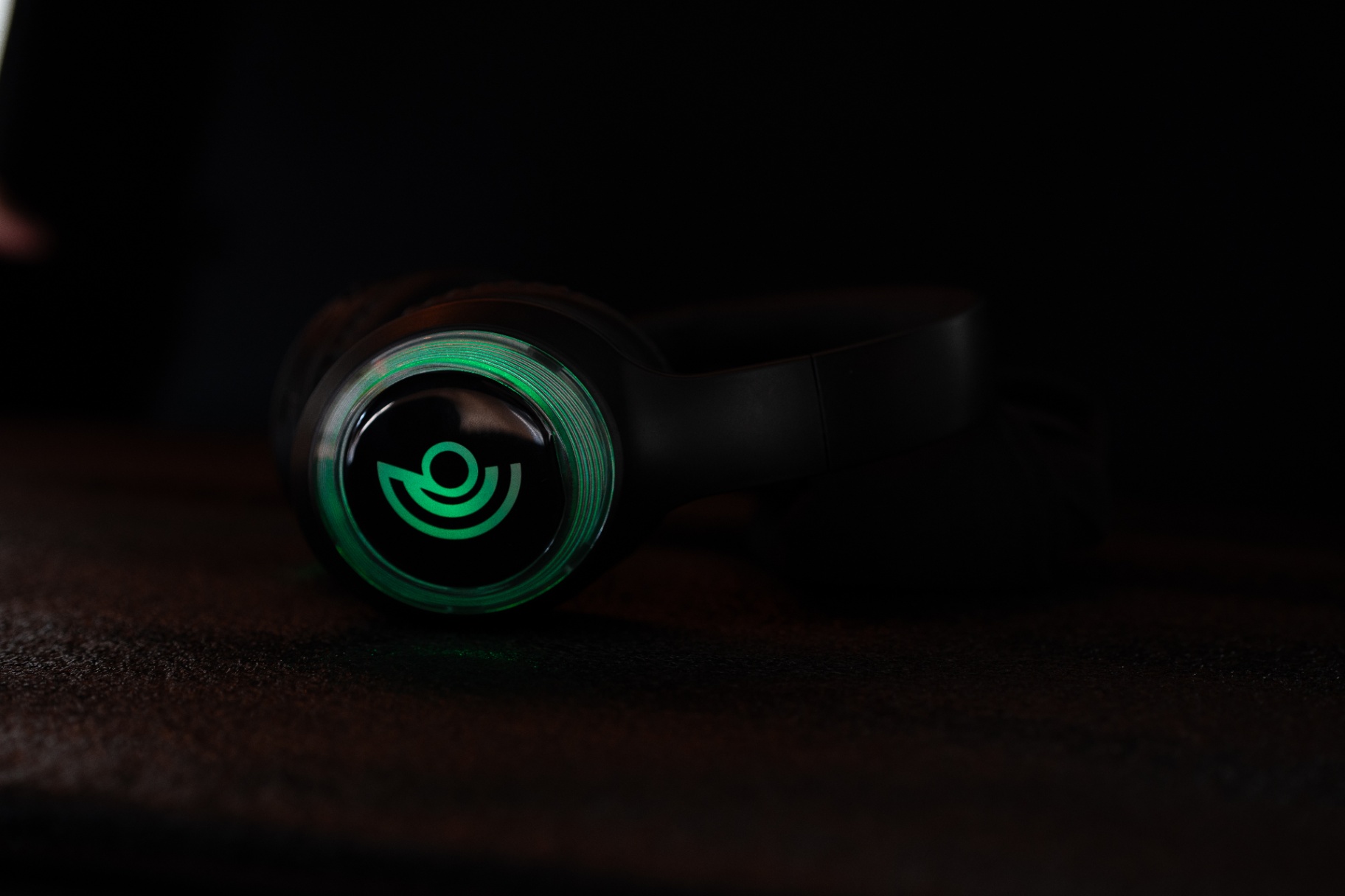 Black Headphones with Green Logo