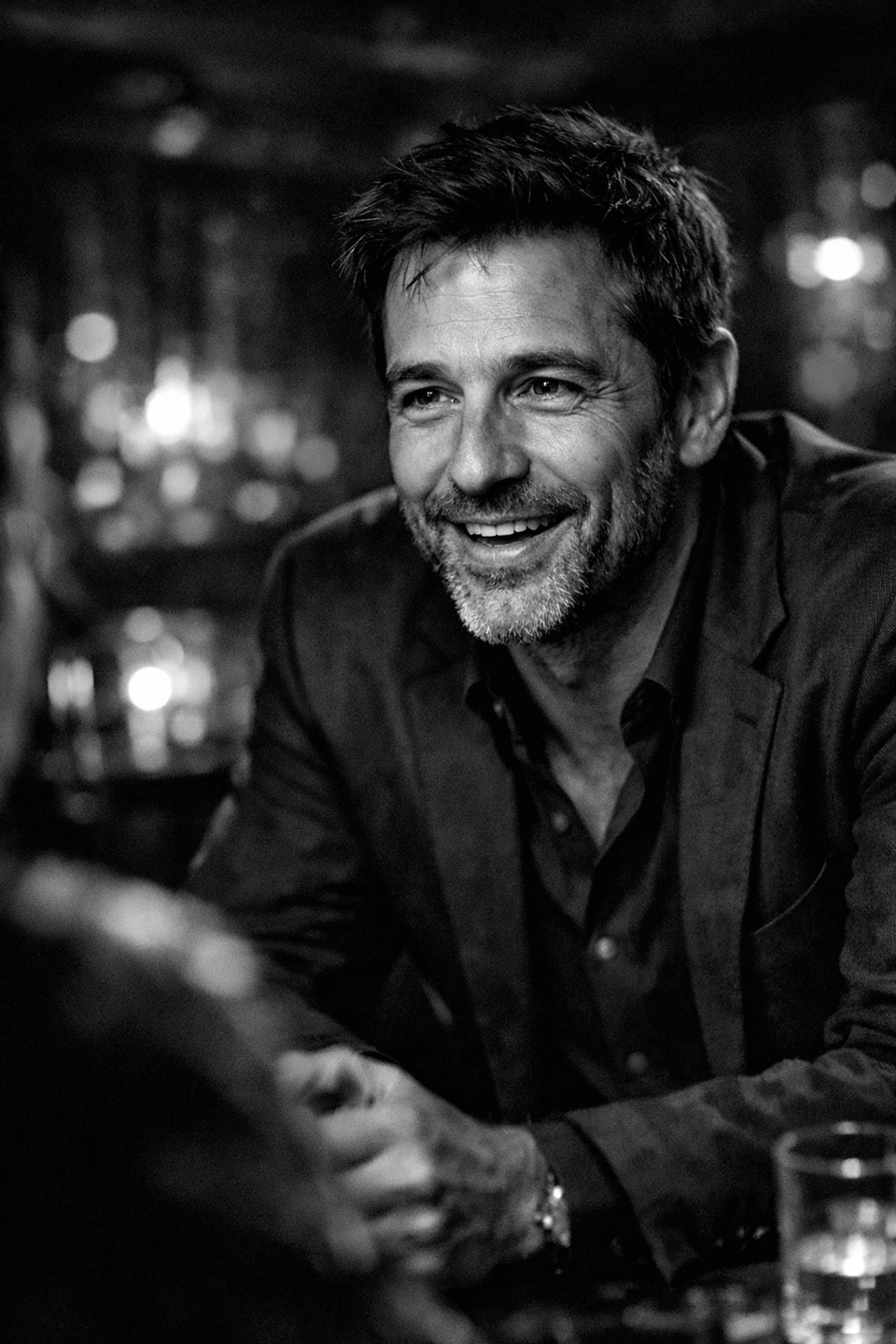 A man practicing natural conversation skills during a date in a sophisticated Sydney lounge.