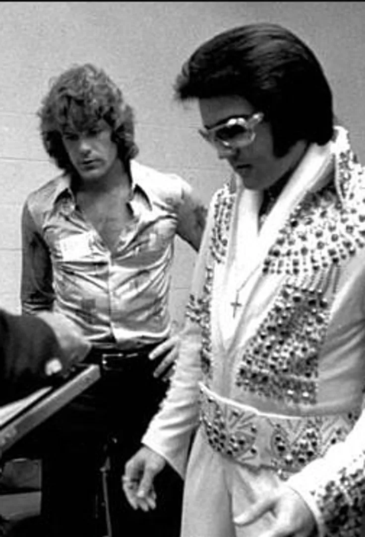 Elvis Presley backstage in the 1970s preparing for a performance