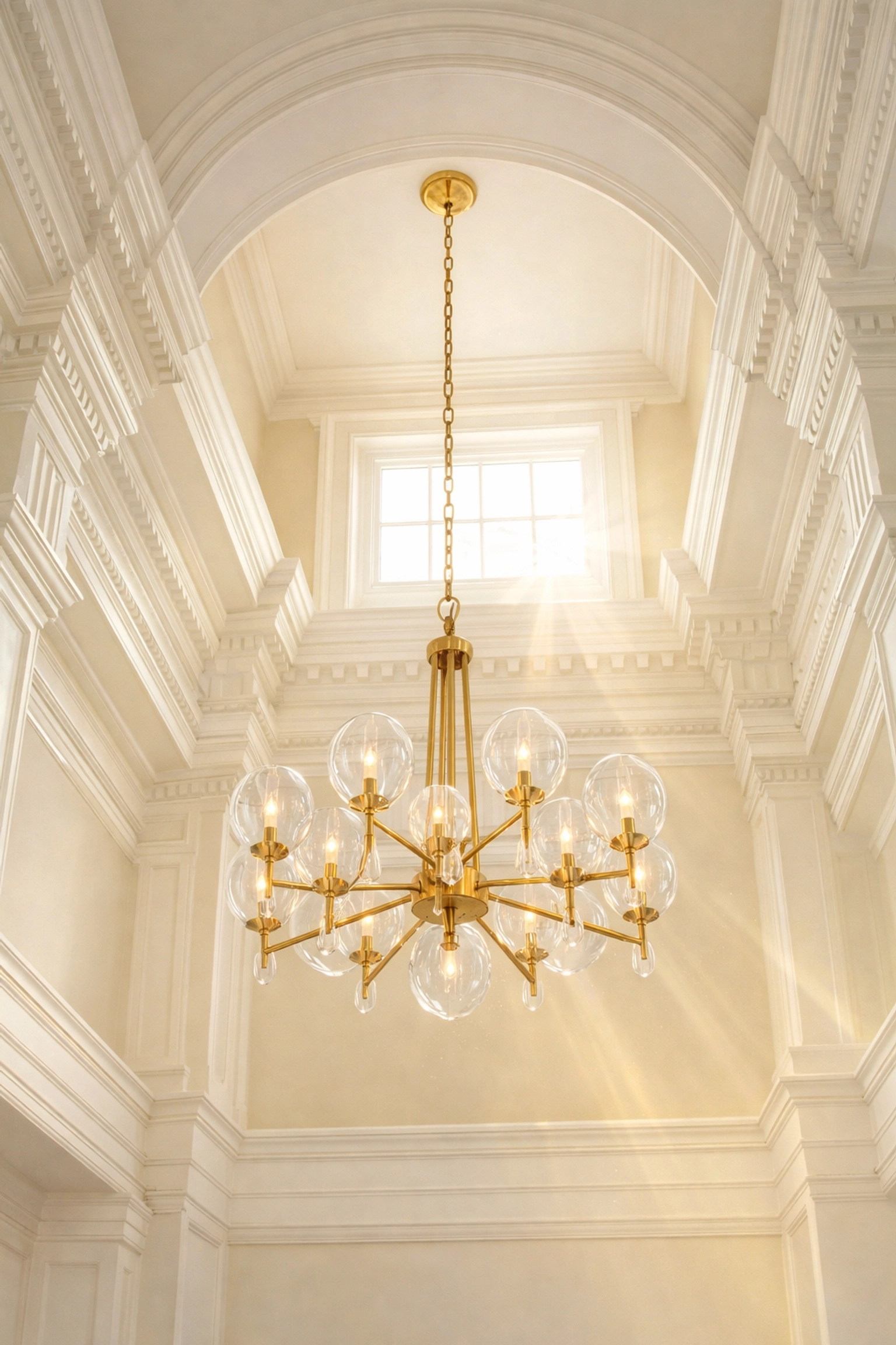 Clean crown molding and brass chandelier in a historic Hingham colonial estate showing expert high-dusting.