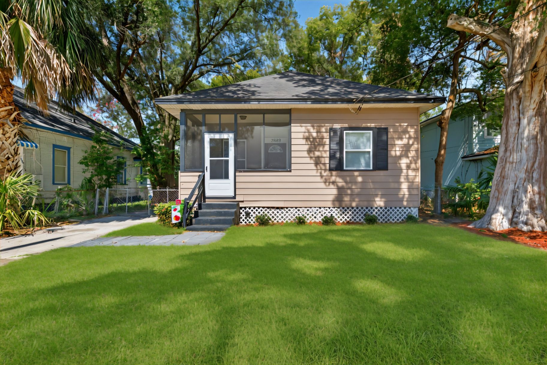 After grass enhancement at 3053 Gilmore St showing lush green lawn